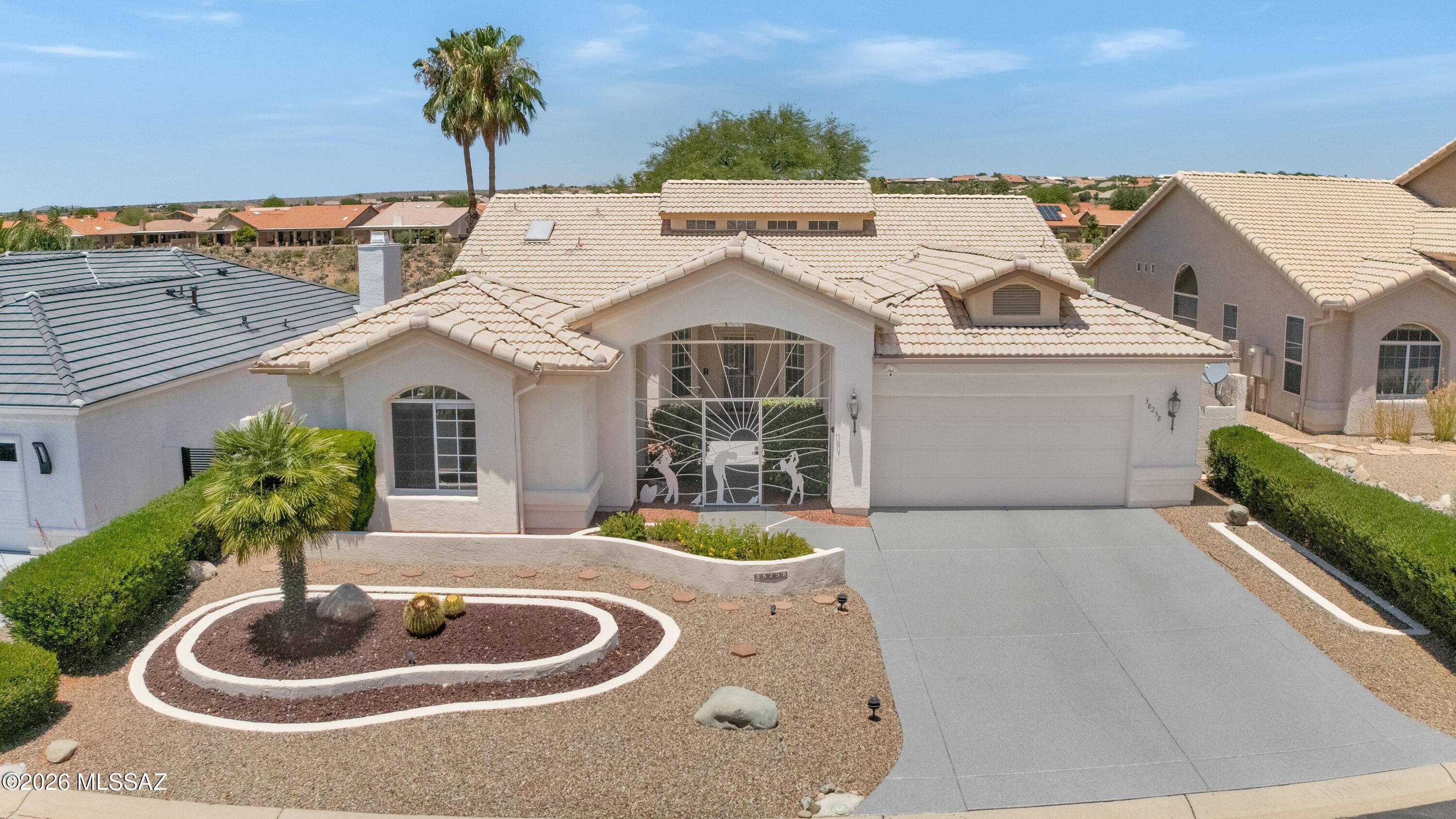 Lovely Estancia with Guest House perched high above the ''Tucson 6'' golf course! Roof underlayment replaced 2024 & Exterior painted 2026. Epoxy-coated driveway & custom entry gate. Great Room with Gas Fireplace. Dining Room & Den with wet bar station. Kitchen offers white & Stainless appliances, cabinets, island, built-in desk, & breakfast nook. Family Room has slider to patio. Full guest bathroom. Owner's Suite includes mini-split & slider to patio. En-suite bath has roll-in shower, jetted tub, & walk-in closet. Laundry Room has W/D & cabinets. Guest House has mini-split, closet, & bathroom. 2-Car Garage has 2024 HVAC & W/H, mini-split, utility sink, epoxy-coated flooring, & cabinets. Enjoy the covered patio with electric security screens, an extended patio, golf course views & gated yar