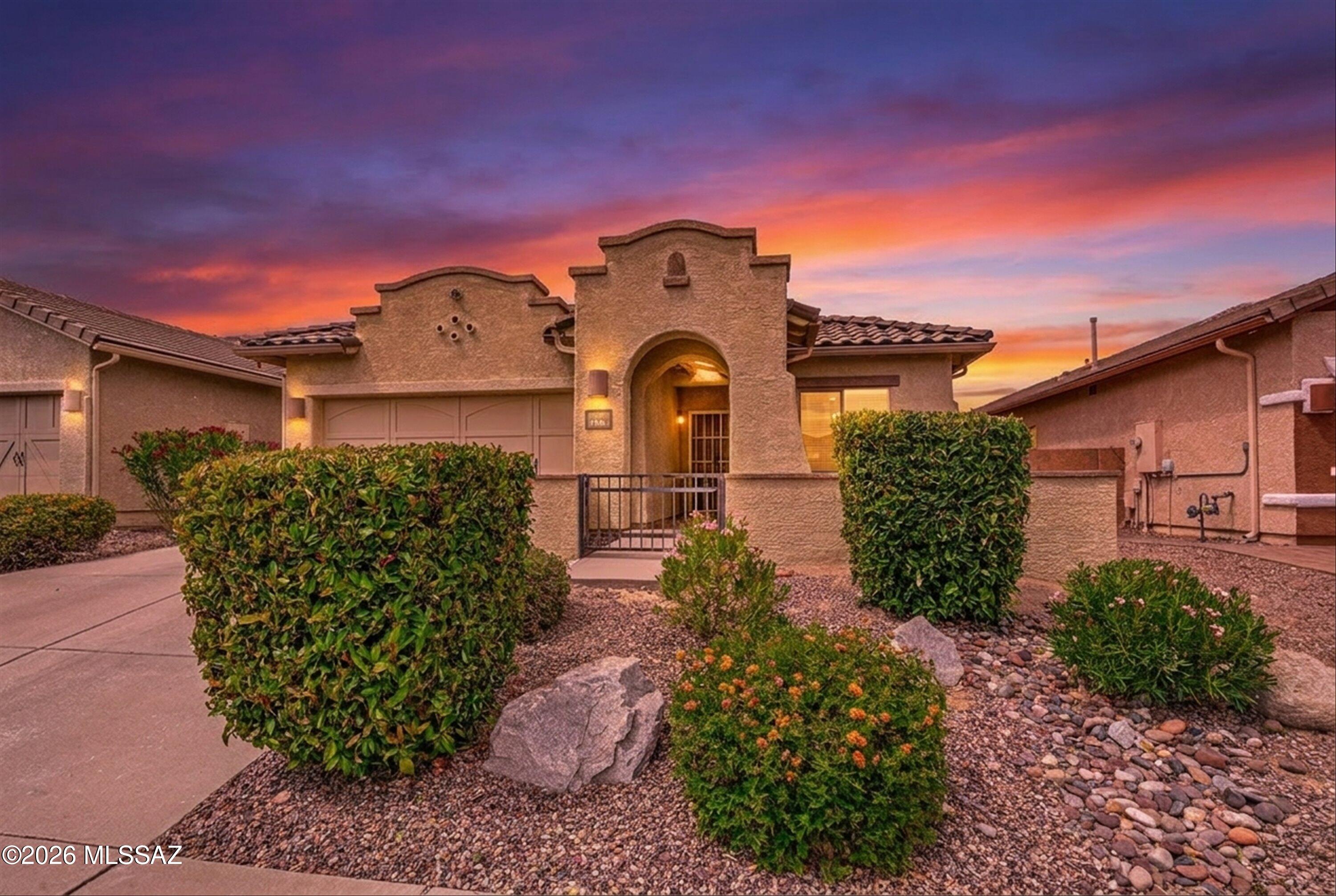 Discover this charming home in Oro Valley's highly sought-after Rancho Vistoso master-planned community. Offering 3 bedrooms, 2 bathrooms, and 1,563 sq. ft., this residence features a bright open-concept layout that seamlessly connects the kitchen, family room, and dining area--perfect for both everyday living and entertaining. The chef-inspired kitchen boasts staggered cabinetry, granite countertops, brand-new stainless steel appliances (including refrigerator), a spacious island with breakfast bar, and a convenient pantry. Recent upgrades include new interior paint, new carpet, and a new water heater, providing a fresh, move-in-ready feel. The spacious primary suite offers a relaxing retreat with a separate soaking tub and shower, dual vanities, a comfort-height toilet with ***MORE*** ......grab bars, and a large walk-in closet. A desirable split-bedroom floor plan ensures privacy for guests, while the guest bathroom features a newly remodeled shower and updated comfort-height toilet. Step outside to your private backyard oasis, complete with a paver-covered patio, lush landscaping, and 10 fruit trees--including apricot--perfect for enjoying Arizona's outdoor lifestyle. Residents of Rancho Vistoso enjoy access to parks, scenic walking trails, sidewalks, and a true sense of community.