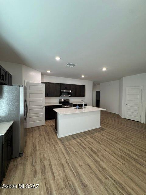 Be the first to live in this brand-new 4 bed, 2 bath home in the sought-after Saguaro Bloom community in Marana! This single-story home offers 1,815 sq. ft. of open-concept living with abundant natural light and modern finishes throughout. The kitchen features quartz countertops, a large island, shaker-style cabinets, and a spacious pantry. The private primary suite includes a walk-in closet and end-suite bath, while three additional bedrooms provide flexibility for family, guests, or a home office. Enjoy a covered patio, huge backyard, attached garage, and laundry room. Community amenities include pools, parks, playgrounds, walking trails, and easy access to I-10, shopping, dining, and schools.