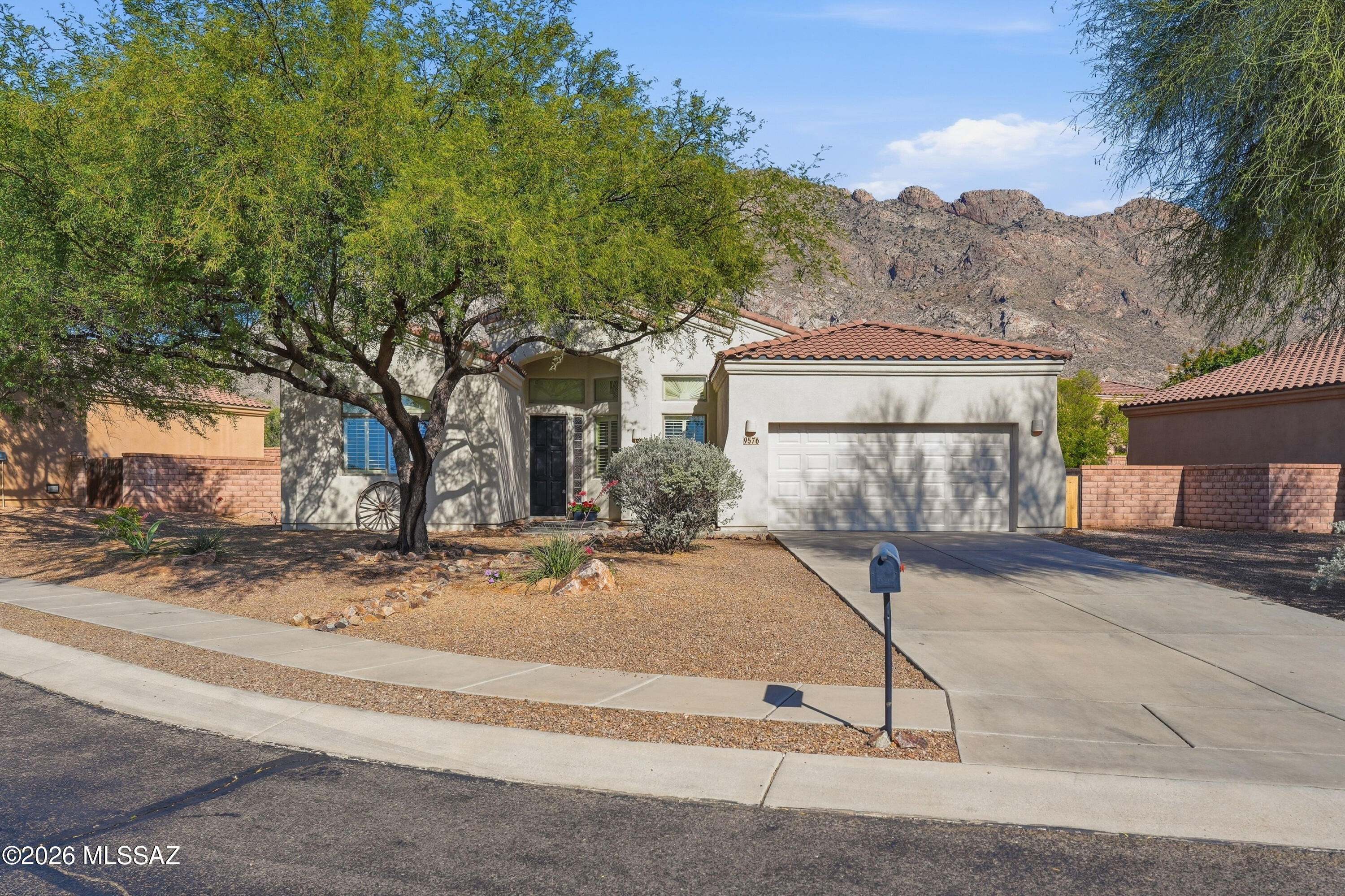 Beautifully updated 3 bed, 2 bath + den home on a quiet cul-de-sac in Oro Valley with Catalina Mountain views. Features include new waterproof RevWood flooring throughout, fresh
interior/exterior paint, and a bright great room with sloped ceilings and recessed LED lighting.
The kitchen offers granite countertops, oak cabinetry with modern black hardware, new stainless steel oven and microwave, and a custom ribbon tile backsplash. Stylish tile fireplace surround adds a modern focal point.
Additional upgrades include a new garage door, with A/C and water heater approx. 5 years old. Enjoy low-maintenance front and backyard and a prime location within walking distance to James D. Kriegh Park and the Oro Valley Aquatic Center.