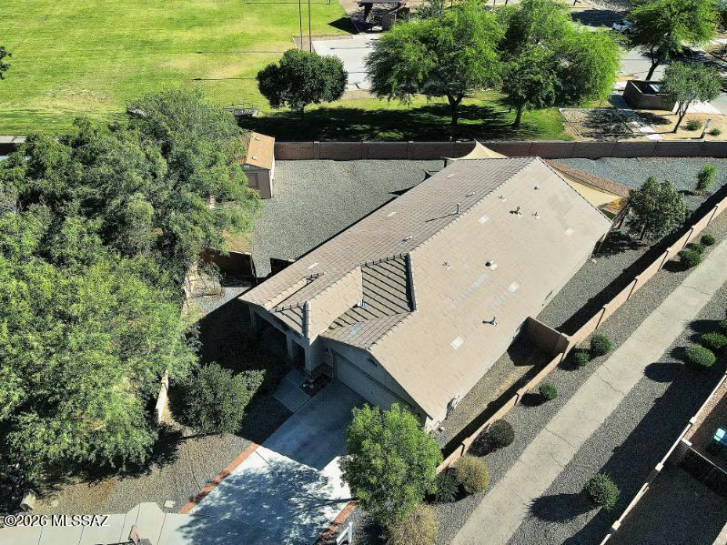 Corner lot backing a beautiful community park with no rear neighbors and extra space on both sides--one side bordered by an easement and the other by a walking path for added privacy. This 9,670 sq ft premium lot offers low-maintenance landscaping, mature trees, artificial turf, shade sails, a covered patio, and a 180 sq ft detached shed ideal for storage or hobbies. Inside, enjoy an open layout with granite countertops, a two-tier breakfast bar, gas range, pantry, and abundant natural light. Split bedroom plan with a primary suite featuring a walk-in closet, soaking tub, and separate shower. Close to parks, walking paths, shopping, dining, and I-10.
