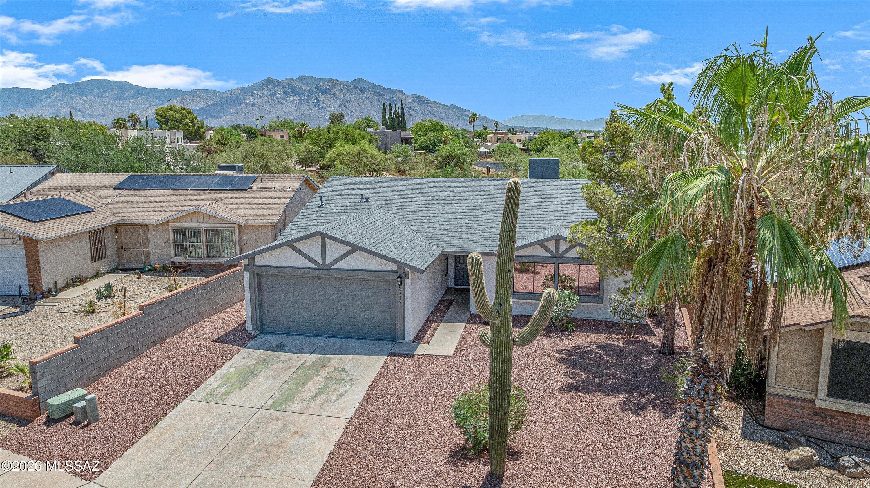 Completely remodeled and truly move-in ready, this beautiful 4-bedroom, 2-bath home blends modern style with everyday comfort. The open great room features soaring vaulted ceilings and flows effortlessly into a stunning island kitchen with upgraded soft-close cabinetry, quartz countertops, matte black hardware, a workstation sink with accessories, and a stainless steel appliance package. Every detail has been thoughtfully updated, including luxury wood-look LVP flooring throughout (no carpet), new doors, trim, baseboards, , and hardware.   The spacious primary suite offers a walk-in closet and a beautifully appointed ensuite bath with dual vanities, while both bathrooms showcase custom tiled showers with designer niches. Major improvements include a new roof with warranty, new water heater and a 2024 HVAC system, providing peace of mind for years to come.
Step outside to a covered patio overlooking a fully fenced backyard that backs to a natural desert greenbelt--offering privacy with no neighbor directly behind. With clean, low-maintenance landscaping and no HOA, this home checks all the boxes. Come see it for yourself and fall in love!