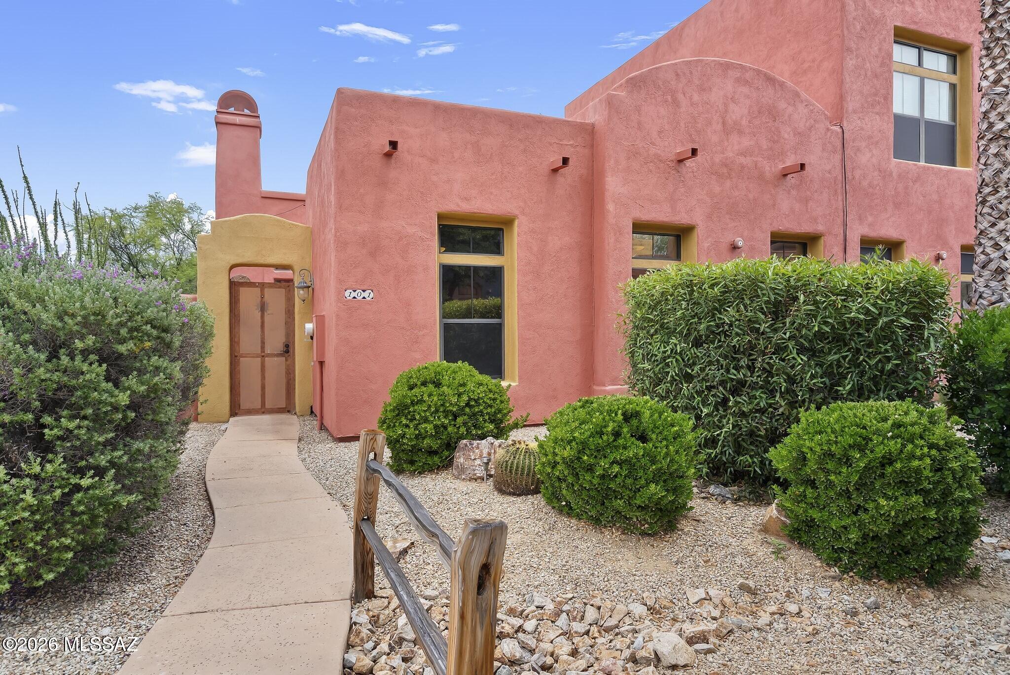Experience effortless resort-style living in this corner-unit, zero-entry townhome located within Tubac's sought-after Embarcadero community. Single-level interior and courtyard-style gated outdoor space, each with its own kiva-style fireplace, provide comfort and convenience. Spacious den is enhanced by a custom Murphy bed and office system, creating flexible space for guests, home office or artist's studio. Desirable corner placement provides abundant natural light and added privacy, where every space is designed to embrace relaxed elegance. Whether you're looking for a full-time residence or seasonal retreat, this exceptional home offers low-maintenance, easy living. Embarcadero amenities include pool, spa, fitness studio and paths that connect directly to the historic Anza Trail.