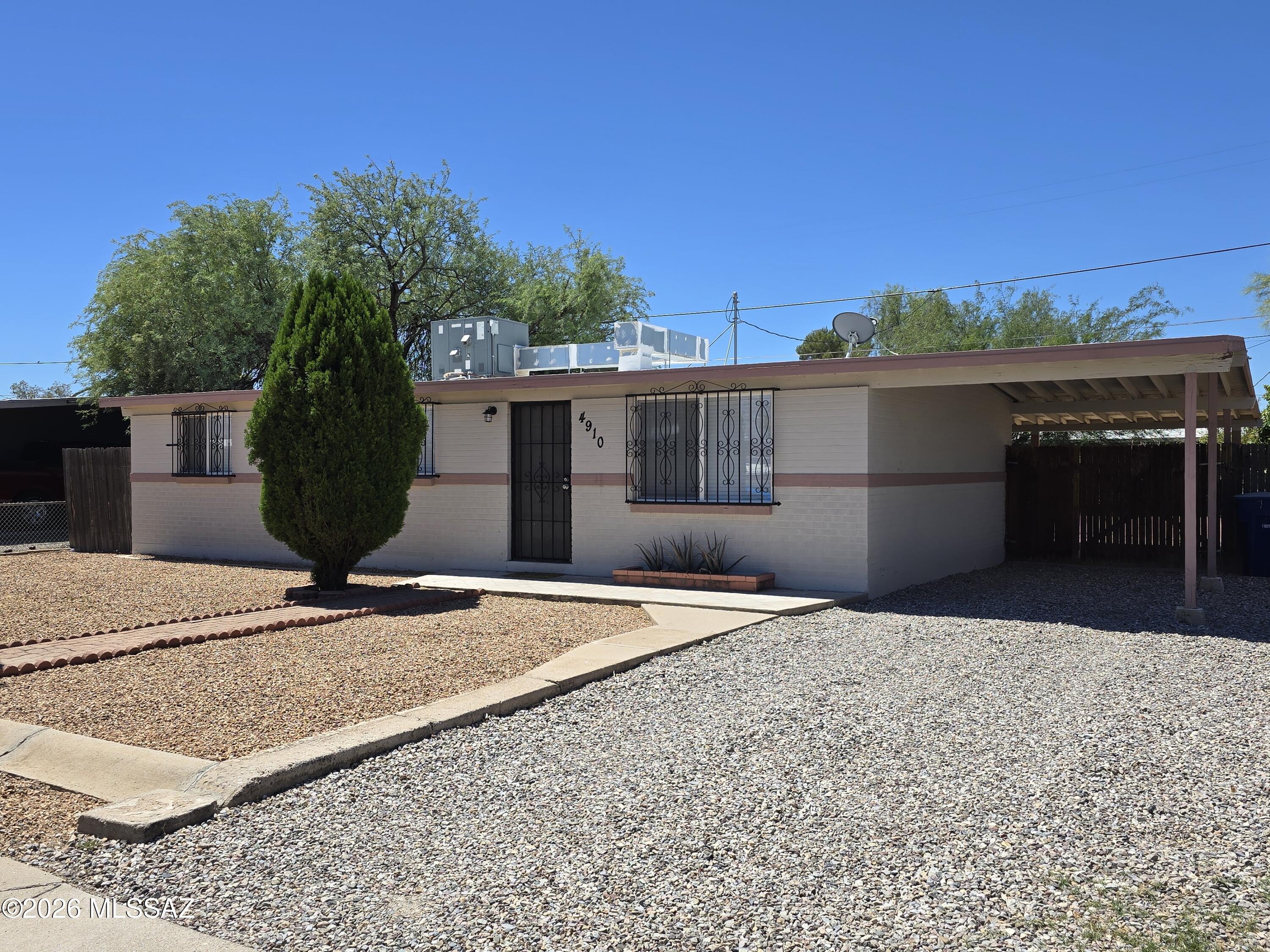 Renovated and waiting for YOU! All tile 3/2 in convenient Central Tucson location! Gorgeous Kitchen with black/stainless gas stove & matching fridge! Laundry room accessible through covered patio! Expansive fenced yard with large patio, pavers and additional storage! Convenient locale close to shopping, schools, and transportation! Don't wait on this wonderful home! GO SEE IT TODAY!