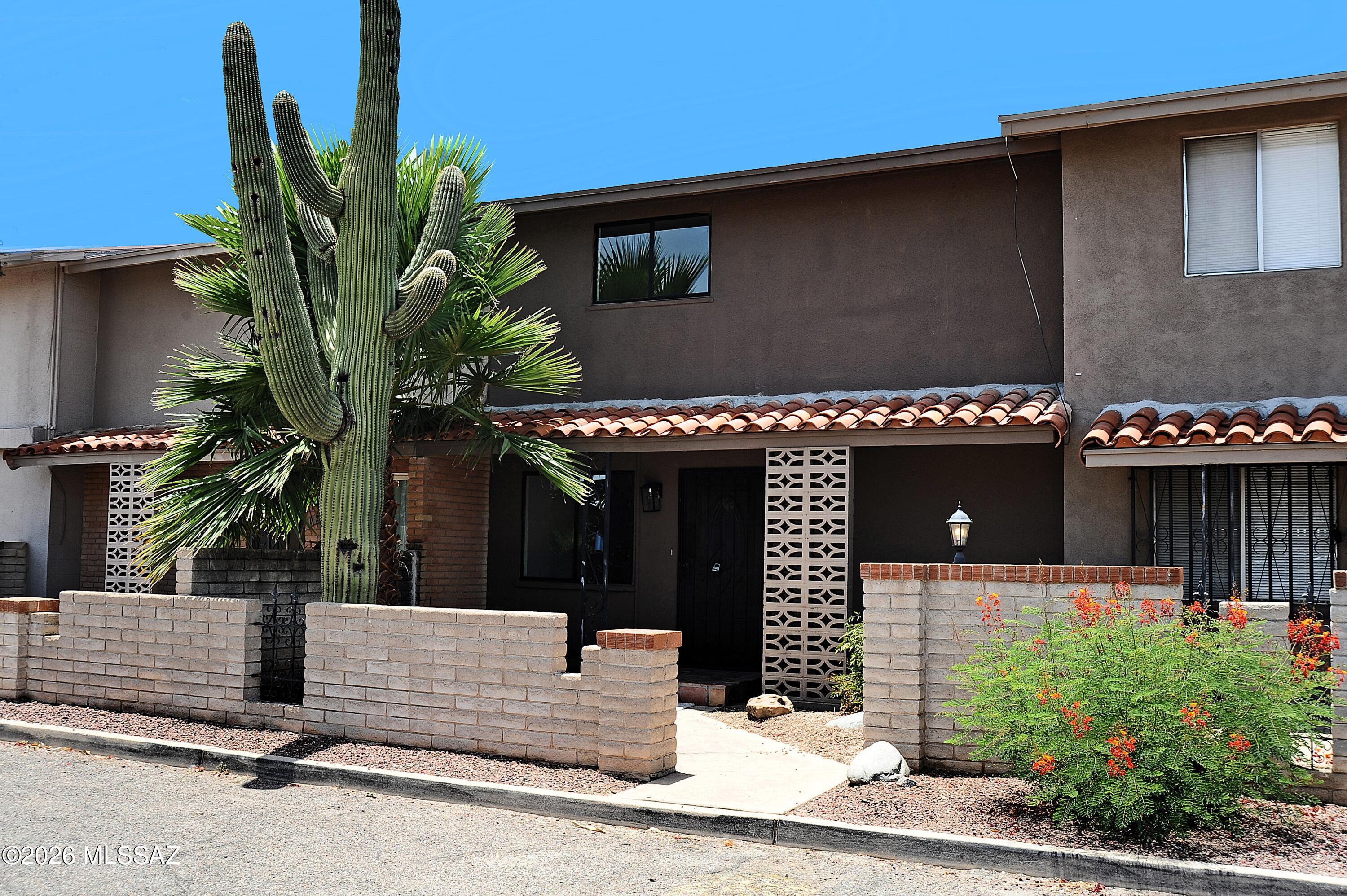 Range priced $220,000-$230,000! Nicely updated and a great price!! Nearly 1600 sq .foot Rolling Hills townhome loaded with character and charm. Open floor plan with bedrooms downstairs and Kitchen upstairs. Clean and move in ready, new custom concrete floors, fresh paint, new carpet. Granite counter tops, stainless steel appliances, two covered parking spaces. Close to schools and shopping and easy commute to downtown and U of A.  Nice community pool and membership to Rolling Hills Golf Course is possible. MOVE-IN READY AND GREAT STARTER HOME. HOA INCLUDES WATER! Owner/Agent