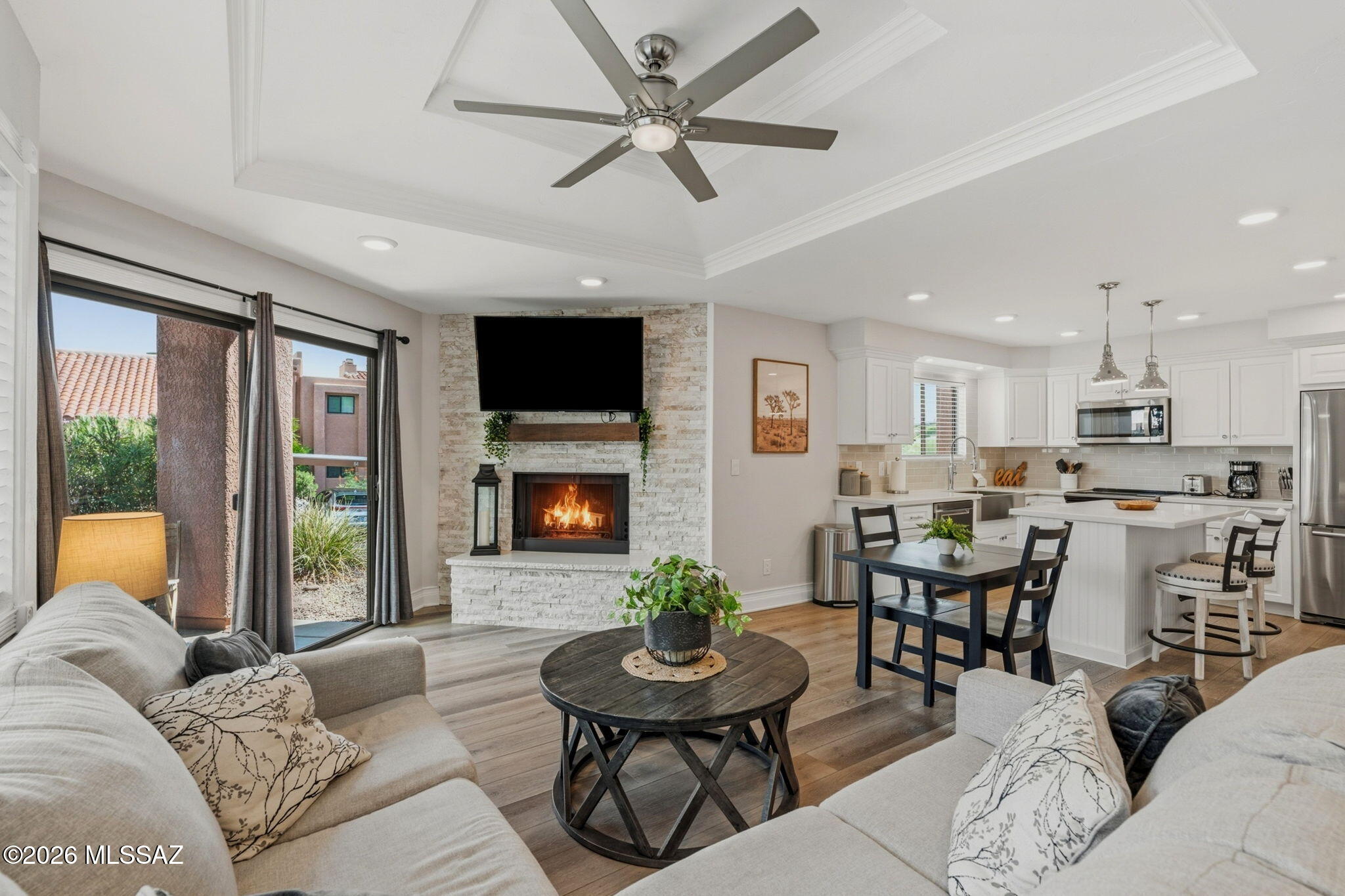 Amazing Opportunity to own this Beautifully updated 1BR/1BA condo in a quiet gated community -- NO OTHER UNIT LIKE IT! This 753 sq ft bottom-floor unit offers no-stairs, easy access with high-end finishes: granite countertops, real wood cabinets with soft-close doors/drawers, farm sink, subway tile backsplash, kitchen island, and vinyl flooring with 6'' baseboards. Stainless steel appliances and washer/dryer with steam feature. Double vanity in bath with executive height counters and subway tile surround shower w niche. HVAC and water heater replaced 2022. Fully furnished, turnkey -- ideal for seasonal residents or investors. Community amenities: pool, spa, clubhouse, rec room, tennis/pickleball. Minutes from Sabino Canyon -- hiking, cycling, shopping and more. Move-in ready. A must-see!