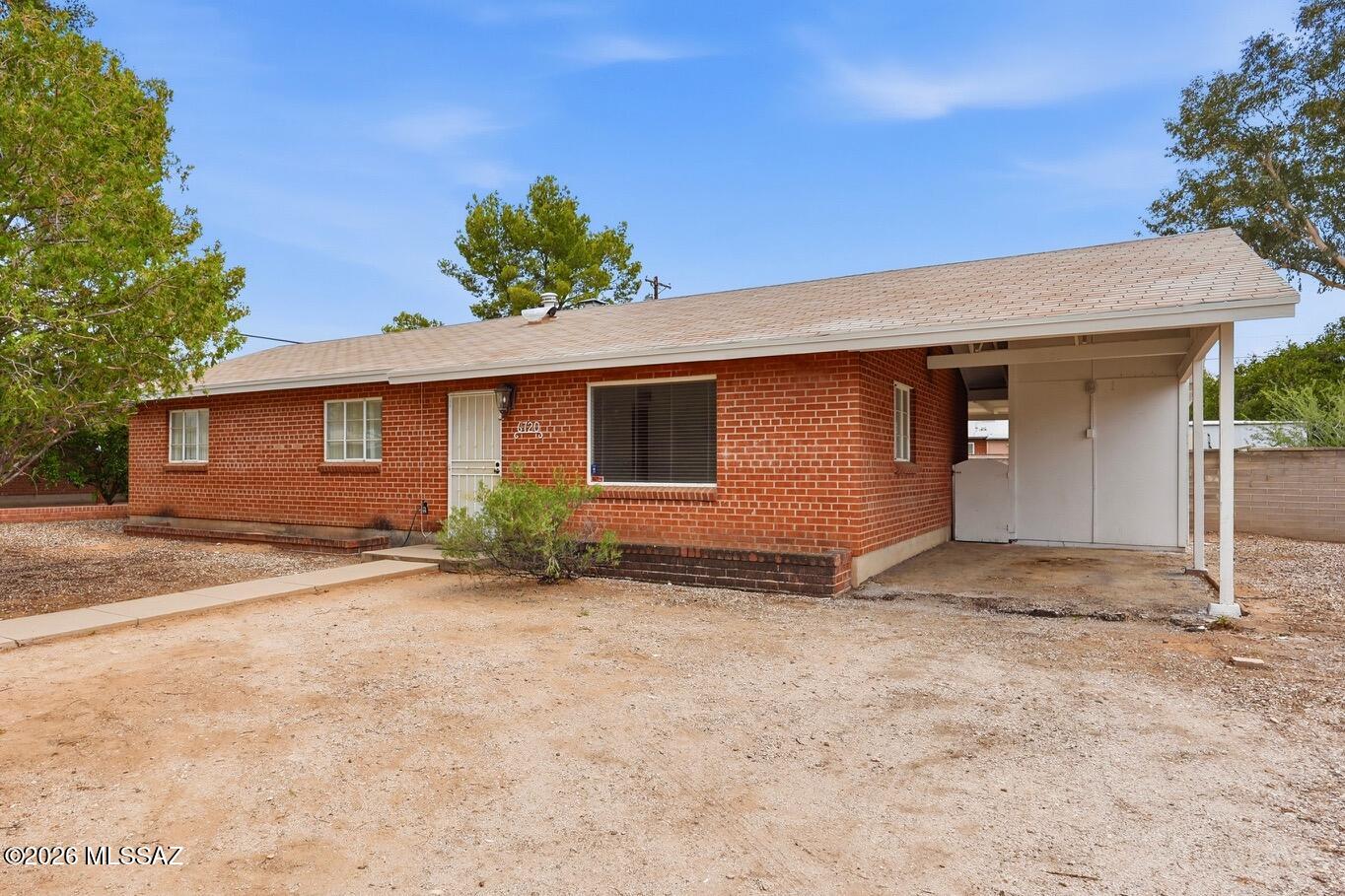 Updated and move-in ready, this charming 3-bedroom, 2-bath brick ranch features a remodeled kitchen and bathrooms, tile flooring throughout the living areas, and major system updates including a newer HVAC (2019), water heater (2020), and updated electrical panel. Enjoy outdoor living in the large walled backyard with a covered patio, perfect for relaxing or entertaining. Complete with a single-car carport, this home is within walking distance of a great neighborhood park and just minutes from shopping, dining, and everyday conveniences.