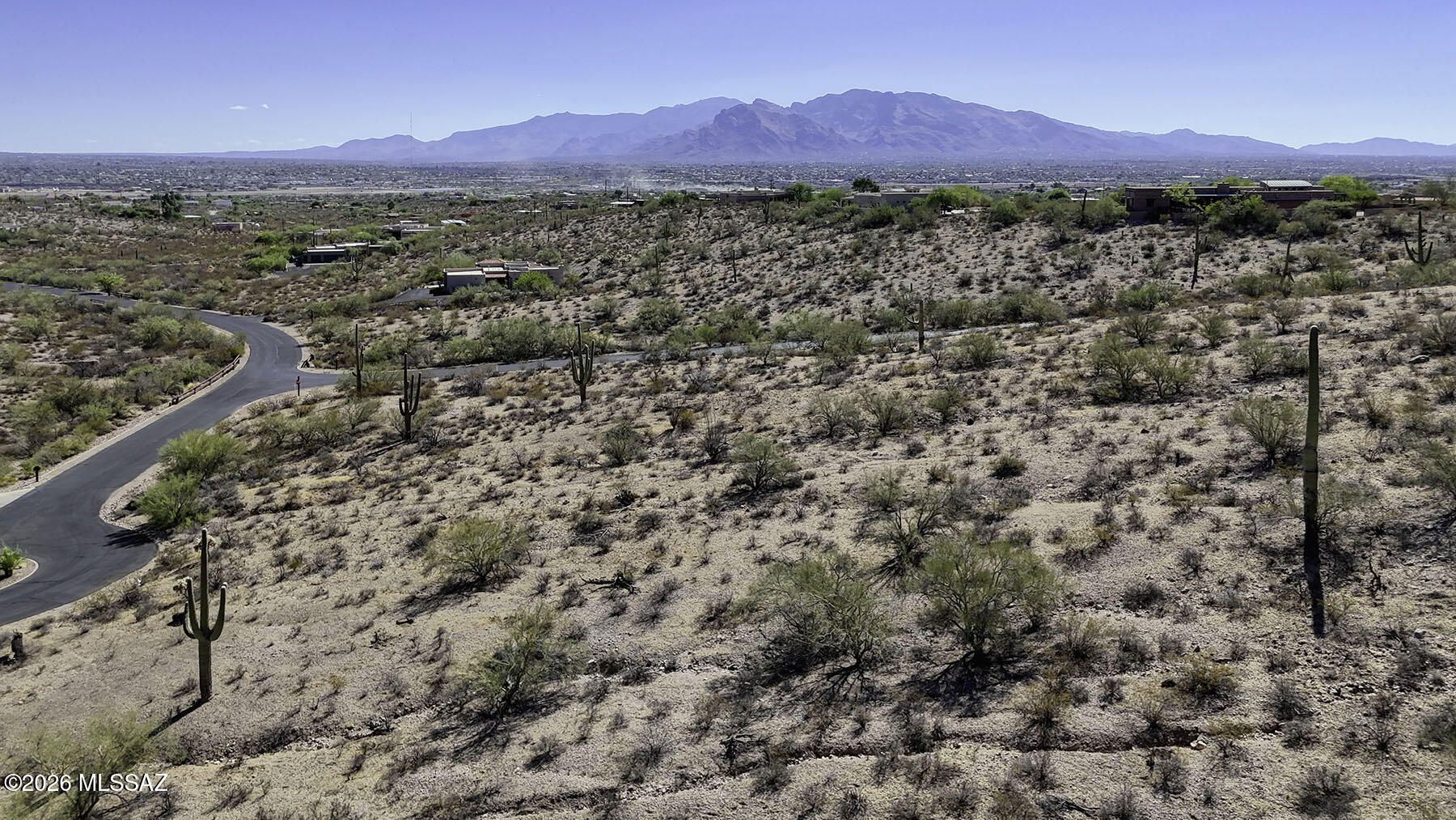 Panoramic mountain, desert, and sparkling city light views surround this exceptional 3.66-acre corner cul-de-sac homesite in the prestigious gated community of Tucson Mountain Reserve. Located high on gently rolling terrain, this premier building site offers breathtaking vistas of the Tucson skyline, the Catalina, Rincon, and Tortolita Mountains, and even the Biosphere on a clear day.  The lush Sonoran Desert setting is enhanced by majestic saguaros, mature palo verde trees, and abundant native vegetation, creating a private and tranquil backdrop for your custom luxury dream home. With 3.3-acre minimum homesites throughout the community, you'll enjoy remarkable privacy while remaining just minutes from Downtown Tucson, the University of Arizona, Gates Pass, major shopping, dining, and Interstate 10.  The water meter is installed, and a soil evaluation will convey with the sale, saving both time and expense as you begin planning your dream residence.  Experience the beauty of the Sonoran Desert, spectacular sunsets, brilliant city lights, and the serenity of one of the Tucson Mountains' premier gated communities, all from this outstanding homesite.