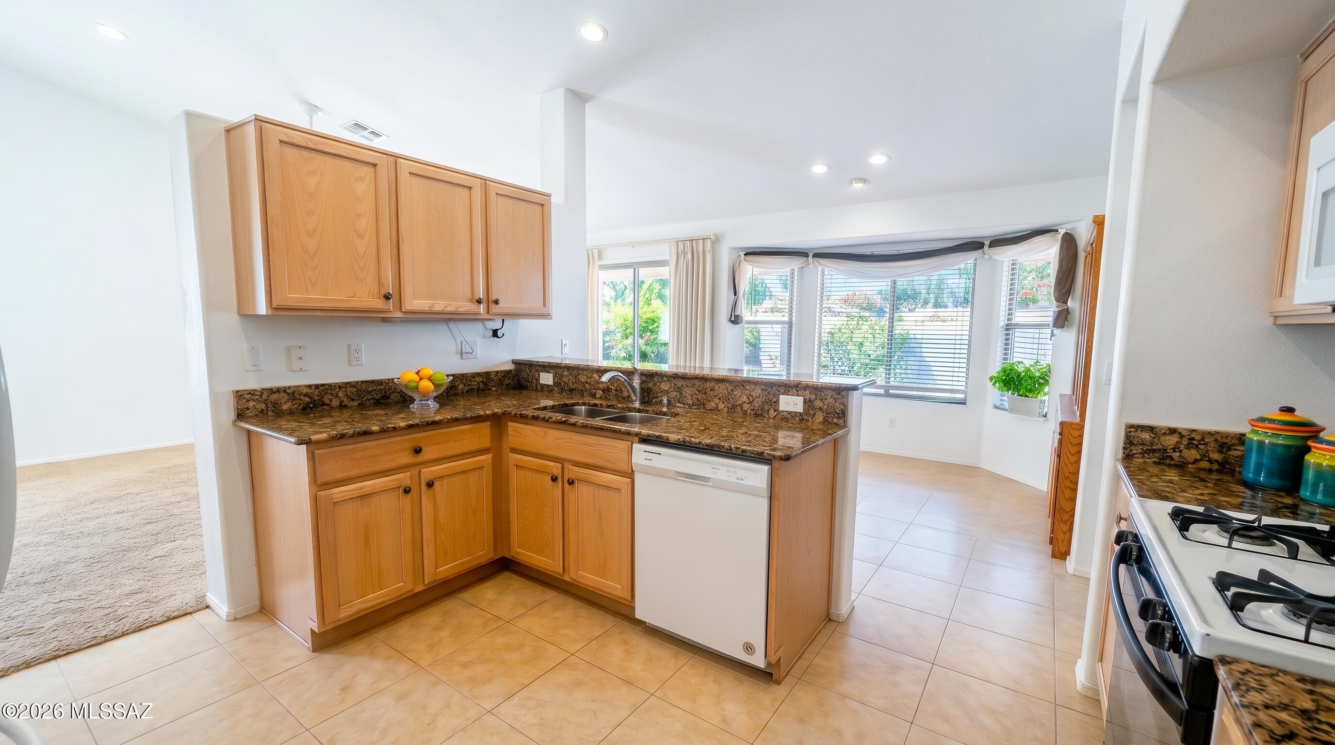 Welcome home to this well-maintained 3-bedroom, 2-bathroom home that's ready to become the foundation for your next chapter. Featuring a desirable split floor plan, a spacious living area, and large windows that fill the home with natural light. The kitchen showcases granite countertops and opens seamlessly to the dining area, with plenty of storage And a laundry room.  The primary suite is a relaxing retreat with dual walk-in closets, a double vanity, and a soaking tub. The two additional bedrooms are privately situated on the opposite side of the home, providing separation and flexibility.
With abundant storage throughout, and a laundry room off the kitchen leading to the garage. Step outside to a backyard featuring mature desert landscaping and a covered patio. Move-in ready.
