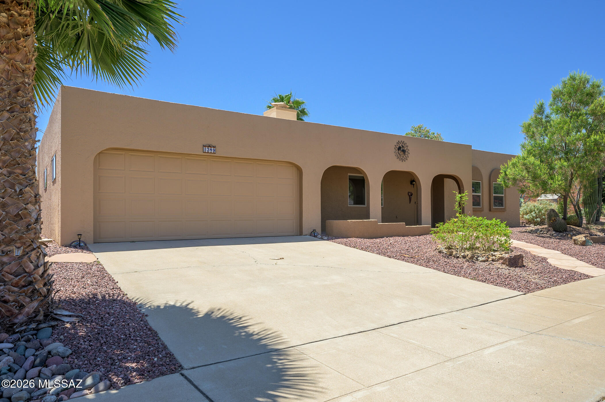 Within this partially furnished home you will find a completely remodeled interior. The front door opens to a great room showcasing a gas beehive fireplace. Its desert tan walls, textured ceiling (no popcorn), tile floors, recessed lighting and newer vinyl replacement windows continue throughout this enhanced home. The solar dome in the kitchen (1 of 3 in the home) illuminates stainless steel appliances, a breakfast bar boasting tile counters and a stylish subway tile backsplash. The kitchen window frames a beautifully landscaped, absolutely private backyard, easily accessible from the Arizona room. A separate den offers a quiet, secluded setting for reading, painting, sewing or in-home office. The totality of this renovation becomes so evident as the tour leads down the hallway to sparkling bathrooms. First, before entering, notice new interior doors and hardware. Then admire the spacious tile walk-in showers, executive height vanities, contemporary glass vessel sinks and backsplash, modern lighting and plumbing fixtures. Nothing within this home has been overlooked. Discover a sturdy, well-constructed exterior featuring quality interior upgrades.