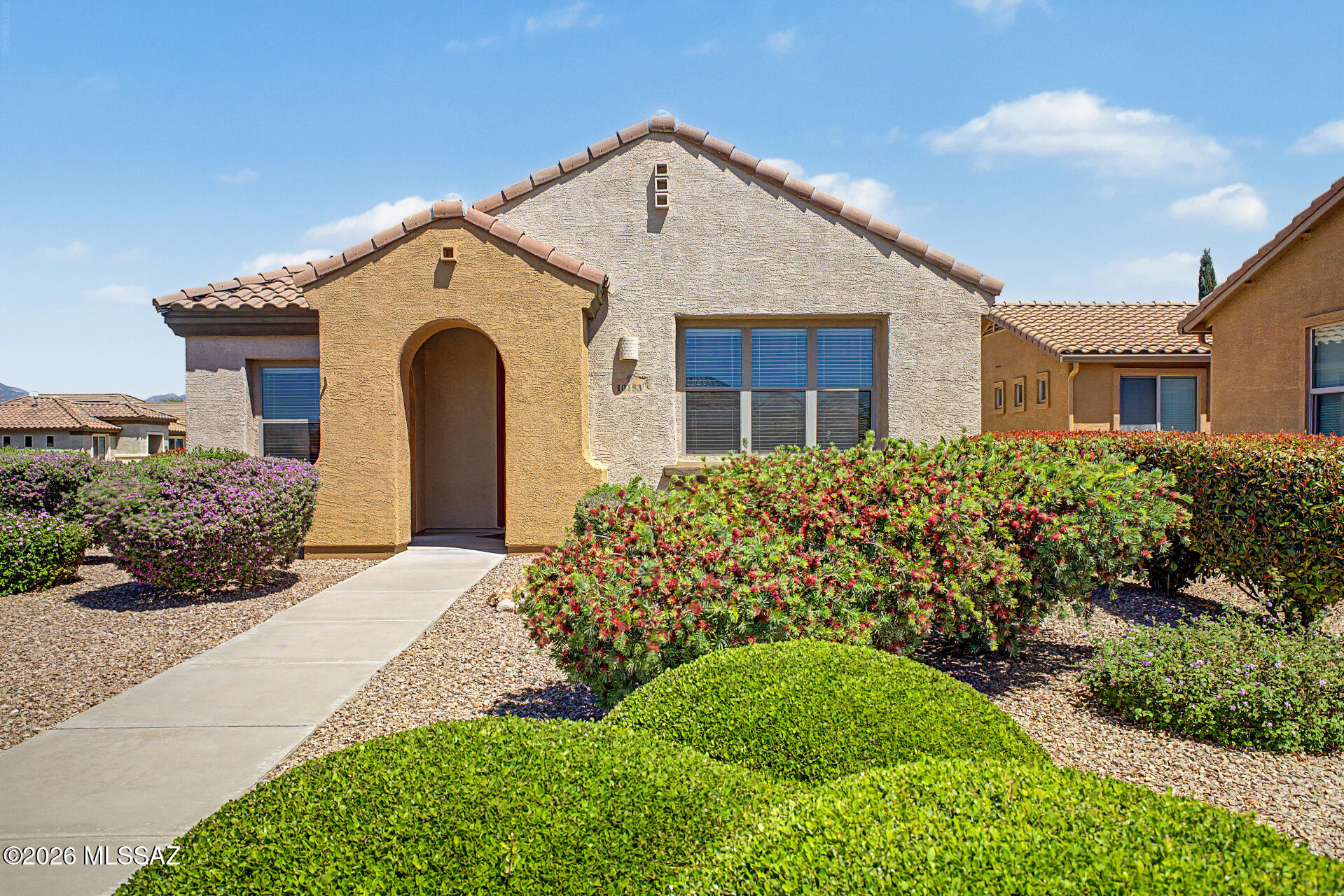 Charming and well-maintained, this corner-lot home is located in Del Webb at Rancho del Lago, a highly desirable active adult 55+ community in the heart of Vail, AZ. Offering over 1,200 sq. ft., this inviting residence features 2 bedrooms, 2 full bathrooms and a bright, open Great Room designed for comfortable everyday living. The kitchen comes fully equipped with all appliances and includes a convenient breakfast bar, perfect for casual dining and entertaining. The spacious primary suite offers a private retreat with an en suite bathroom featuring a dual vanity, walk-in shower and a large walk-in closet.  Residents of Del Webb at Rancho del Lago enjoy an exceptional lifestyle with access to resort-style amenities and activities, including swimming, spa, fitness center, pickleball, tennis, bocce, classes, and scenic walking paths. Ideally situated adjacent to Del Lago Golf Course, this gated community is also close to shopping, dining and recreation options, offering both convenience and an active, engaging lifestyle in a beautiful desert setting.