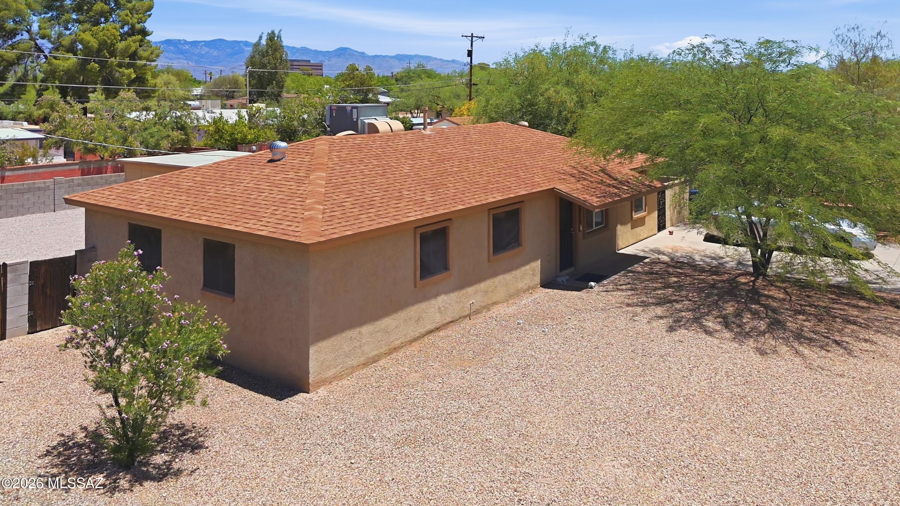 Priced below October 2025 appraised value of $320,000 -- listed at $295,000 to create a competitive offer environment. Seller is a licensed AZ broker offering full transparency: pre-inspection completed, contractor repair estimate on file, home warranty included at closing. No surprises, no games.
1961 Del Monte Village ranch in established Midtown Tucson neighborhood. 4 bed / 2 bath / 1,300 sqft single story. Remodeled kitchen and bathrooms, double-pane windows, central heat and air, large covered rear patio, covered front porch. Detached shop/laundry outbuilding with independent alley access -- rare bonus at this price point with ADU conversion potential under current AZ law. Buyers to verify with City of Tucson PDSD.
Mature tree-lined street. Walk to Hoffman Park and Desert Aire Park.