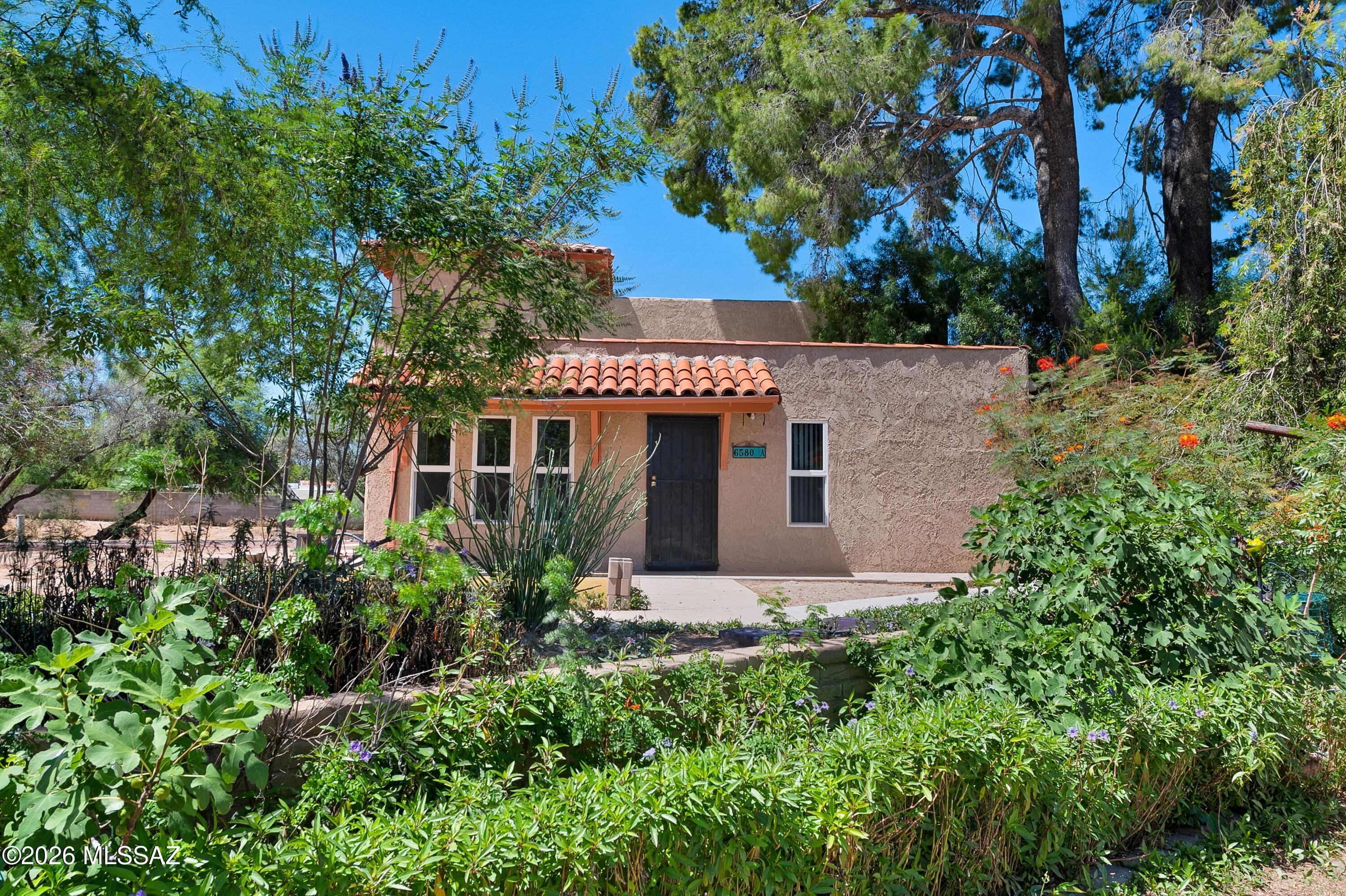Welcome to one of the best opportunities in the highly sought-after Meadows community! Tucked away in a peaceful and private setting near Grant Road and Tanque Verde Road, this beautifully maintained ground-level ''A'' unit offers the perfect combination of comfort, convenience, affordability, and low-maintenance living in one of Tucson's most desirable locations.

From the moment you arrive, you'll appreciate the secluded feel of this charming single-level condominium. Thoughtfully cared for and move-in ready, this residence showcases pride of ownership throughout and provides an exceptional opportunity for first-time homebuyers, seasonal residents, downsizers, or anyone seeking a lock-and-leave lifestyle without sacrificing comfort.

Step inside and discover a bright, welcoming inter featuring a blend of ceramic tile and wood flooring that offers both durability and timeless appeal. The functional floor plan creates an inviting atmosphere, while the well-appointed kitchen comes complete with stainless steel appliances, providing a modern touch and making meal preparation a pleasure. A recently updated bedroom features attractive new laminate flooring, further enhancing the home's fresh and updated feel.

Designed for easy maintenance and everyday convenience, this home allows you to spend less time on upkeep and more time enjoying everything the surrounding area has to offer. Central air conditioning ensures year-round comfort, while the spacious north-facing patio provides the perfect setting to enjoy Tucson's beautiful weather. Whether you're sipping your morning coffee, reading a good book, or entertaining friends and family, this outdoor space offers a peaceful retreat to relax and unwind.

One of the standout features of this property is the rare convenience of covered parking spaces within the rear carport area, along with an additional storage space--providing ample room for vehicles, seasonal items, outdoor gear, and more.

The value extends far beyond the walls of the home. The association fees cover an impressive range of services and benefits, including a blanket insurance policy, roof repair and maintenance, common area maintenance, garbage collection, pest control, and additional community services that help simplify homeownership while protecting your investment.

Residents of The Meadows enjoy a welcoming community atmosphere and access to desirable neighborhood amenities, all while being conveniently located near some of Tucson's best shopping, dining, entertainment, medical facilities, and everyday conveniences. The property's prime location also provides easy access to highly regarded schools, recreational opportunities, parks, and major transportation corridors, making daily commuting and errands exceptionally convenient.

Opportunities to own a ground-level unit in this desirable community are few and far between. Combining a private location, low-maintenance lifestyle, covered parking, valuable HOA benefits, and an ideal Tucson location, this home truly checks all the boxes.

Whether you're looking for a full-time residence, seasonal retreat, or investment opportunity, this meticulously maintained condominium is ready for its next owner to move right in and enjoy. Don't miss your chance to own this rare gem in The Meadows--schedule your private showing today and experience everything this exceptional property has to offer!