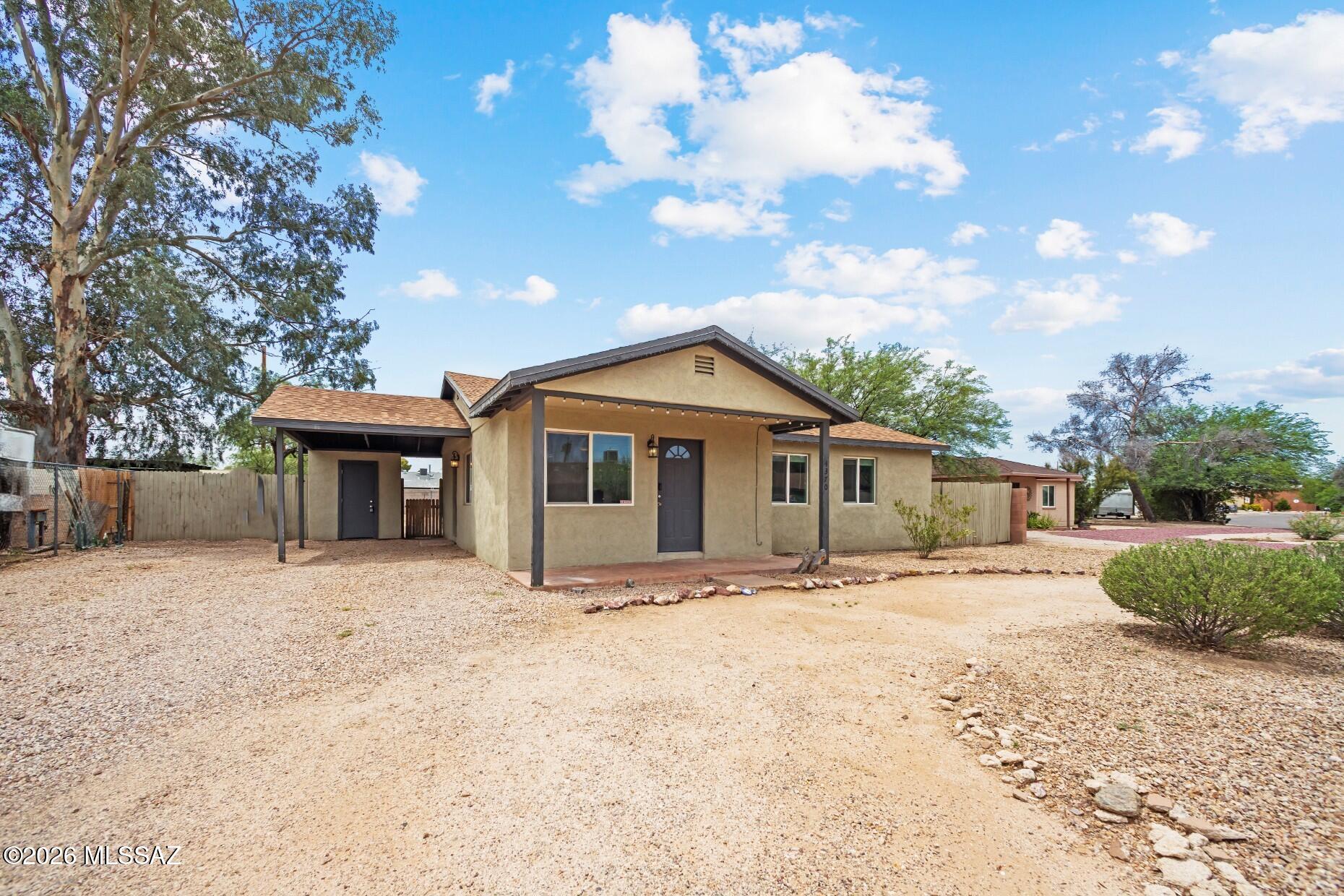Range Priced: $300,000 - $315,000, seller shall counter or accept offers within range. 

Welcome to your future ''Happy Neighborhood'' aka ''Colonia Allegre!'' This masonry stucco 3 bed and 2 bath home resides in a well-established Central Tucson community, placing you mere minutes from grocery stores, shopping, acclaimed restaurants and more. As you approach this home, the almost quarter of an acre lot is impressive and spacious (COT now allows for up to three additional dwellings to be built on this land). Once you step inside, the property's 2020 complete remodel is evident. The kitchen boasts stainless steel appliances, quartz counters, and modern lighting accented by the wood-look tile flooring. Both bathrooms feature sleek tilework with updated vanities. New roof shingles, dual-pan windows and HVAC system added in 2020 too. Don't miss the carport (with storage closet) as you head to the expansive backyard. No HOA means the possibilities are endless to create your ideal space. Schedule a private tour before it's too late.