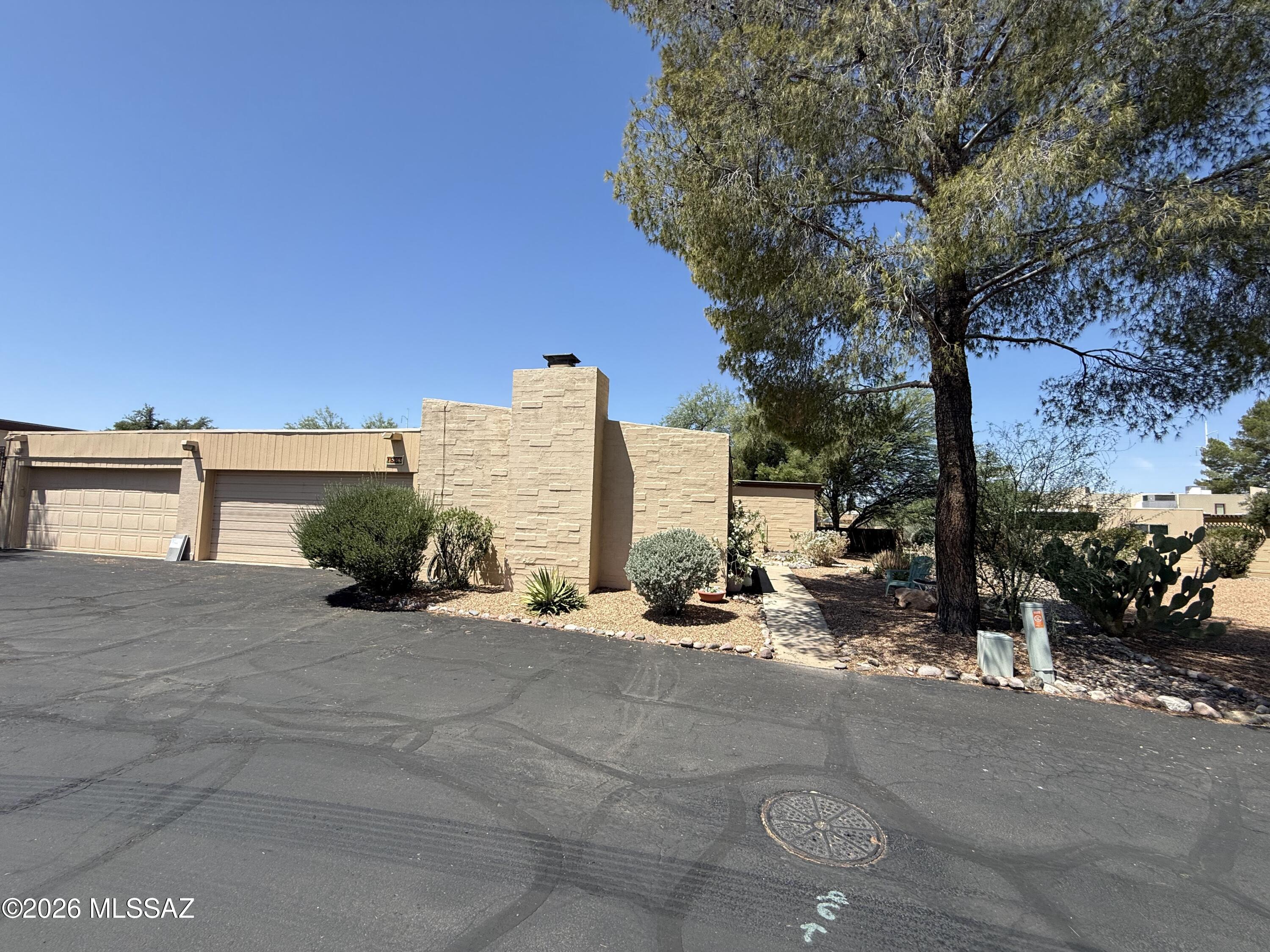 Move-in ready Eastside Tucson townhome featuring 3 bedrooms, 2 bathrooms, and 1,634 sq. ft. in a quiet, desirable neighborhood. This meticulously maintained home offers dual-pane windows and sliding doors with a lifetime warranty, a new roof (2024), new HVAC (2025), and fully owned solar panels (2025)--no lease or loan to assume--for exceptionally low utility costs. Additional features include a spacious 2-car garage with dual openers and a new garage door frame (2023). Relax on the large Italian-tiled covered patio shaded by a mature olive tree. Conveniently located near shopping, dining, parks, public transportation, and more. A perfect blend of comfort, efficiency, and location.
