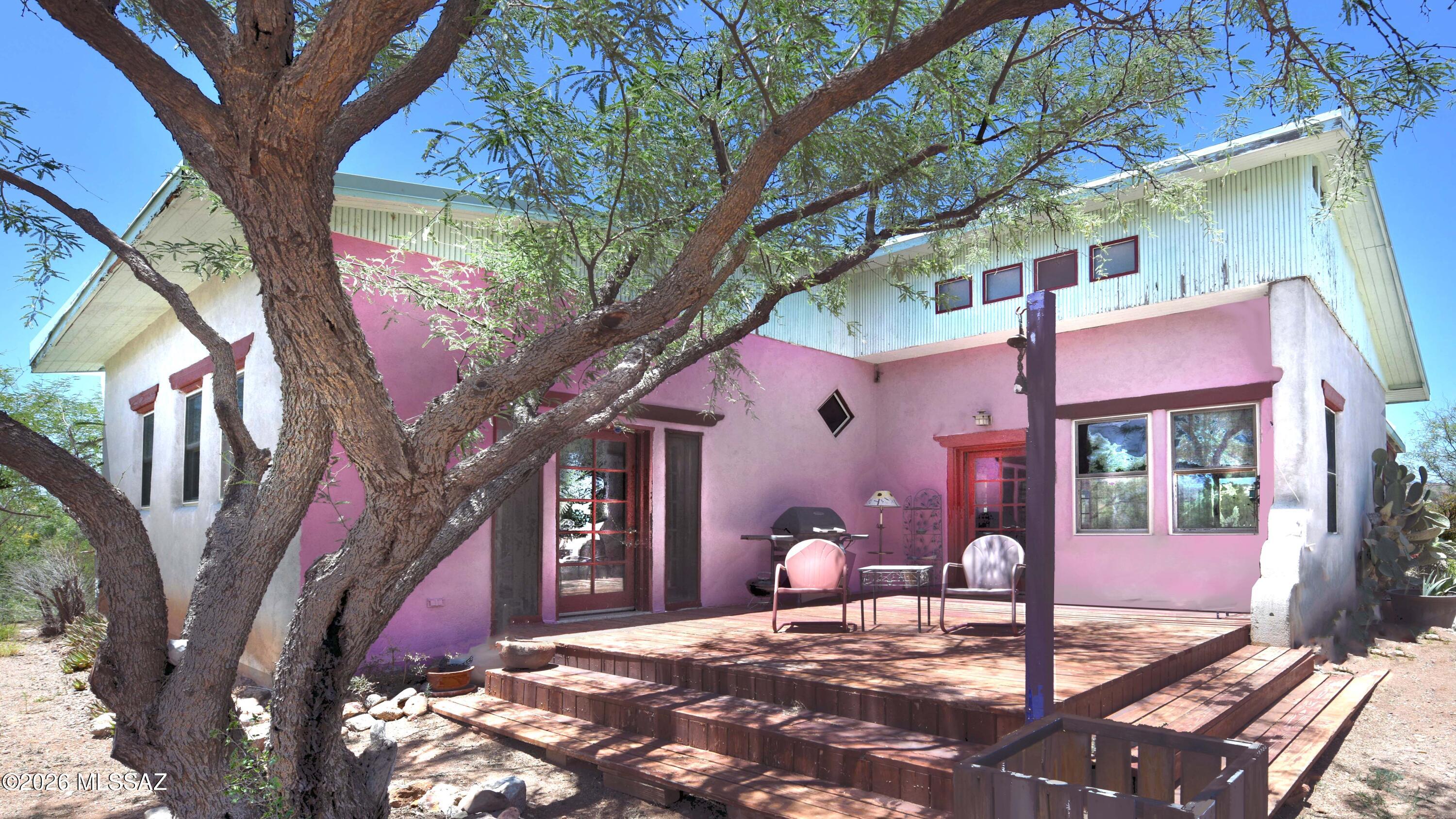 Stunning heart-of-Patagonia hilltop setting  ~uncommonly pleasing for its privacy & 360 mountain views of this renown Sky Island setting. Built of substantial Rastra/ICF Block c.2004, its 1779sf feature soaring ceilings & many windows & outdoor seating areas from which to savor this amazing setting. The home has just the one o/s Master Bedroom & the single Bathroom, which is directly across the wide hallway from the Master. The sunny multi-purpose Bonus Rm could be used however you wish, including a BedRm. The GreatRoom is nicely proportioned & includes Living-Dining area, Kitchen, & walk-in Pantry. It opens out to both the AZ Rm & the Front Entry Deck. The directly adjacent 200'x135' parcel may be purchased with a separate bill of sale. What a great horse property or guest house setting!