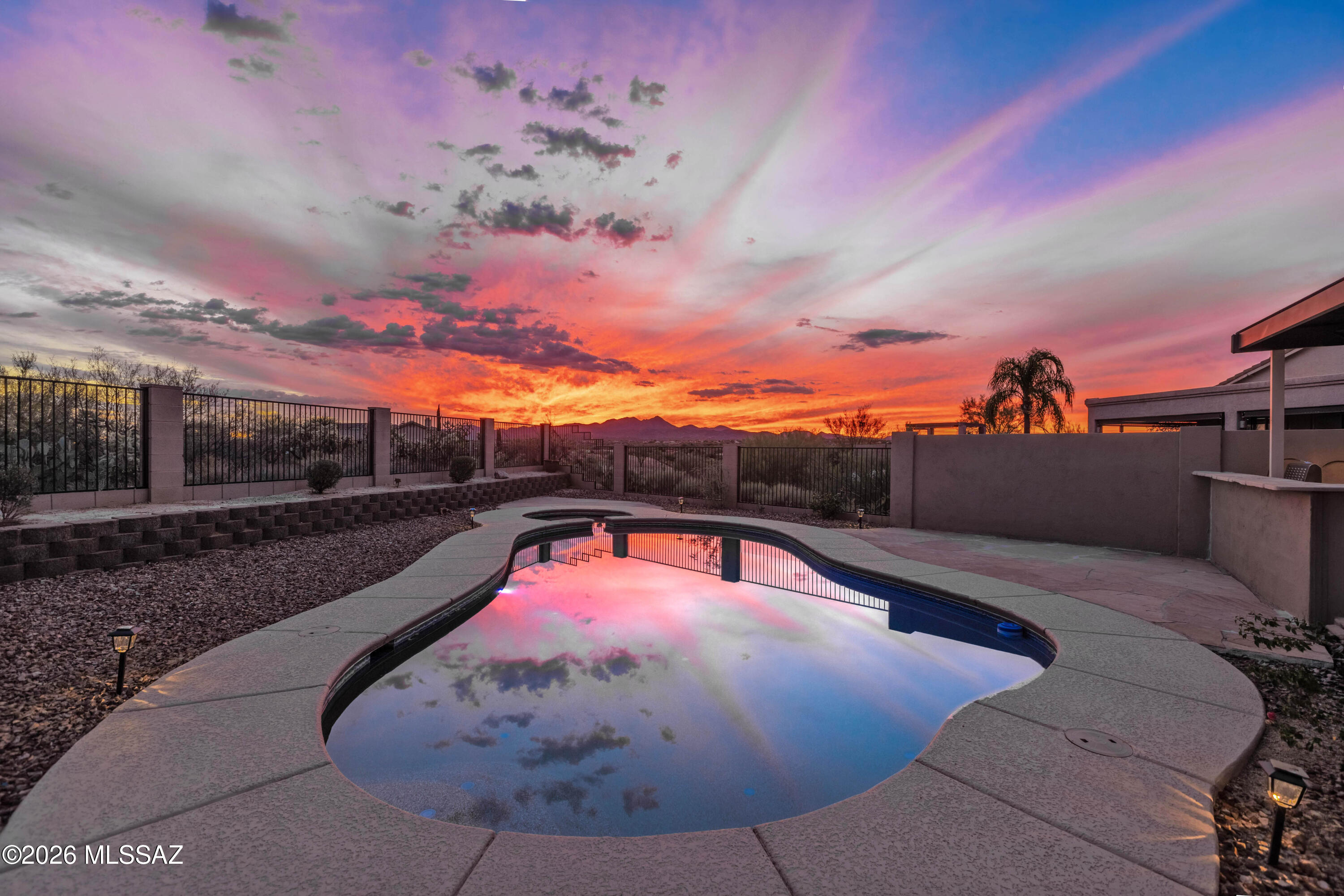 Luxurious Outdoor Living with Unparalleled Mountain Views! Beautifully updated 4-bedroom home backing to miles of natural open space with breathtaking mountain views and exceptional privacy. The resort-style backyard is designed for entertaining with a heated pool, new Kool Deck, covered patio with sunscreens, and a fully equipped outdoor kitchen featuring a BBQ, refrigerator, sink, and fireplace. The remodeled kitchen offers quartz countertops, new stainless-steel appliances, breakfast nook, and opens to the family room. The spacious primary suite features a spa-inspired bath and walk-in closet. Additional upgrades include tile flooring, new carpet, 3-car garage, new HVAC, new roof, new water heater, fresh interior paint, and more. Truly move-in ready!