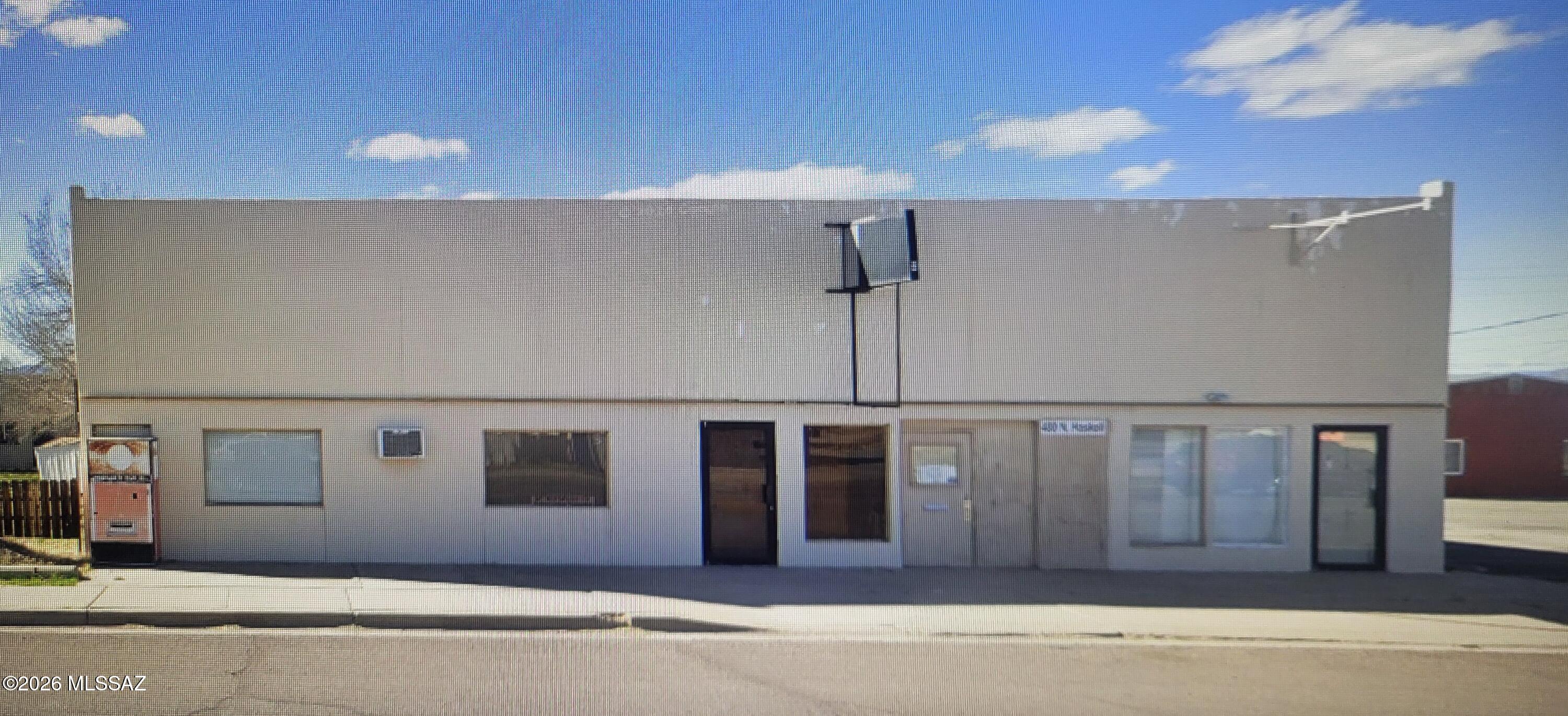 Original 2400 +/- sq ft masonry building with a steel structure covering the masonry building allowing a second story.  The steel building extends to the rear lot line (alley)  giving a fully enclosed High ceiling warehouse or fabrication bay.