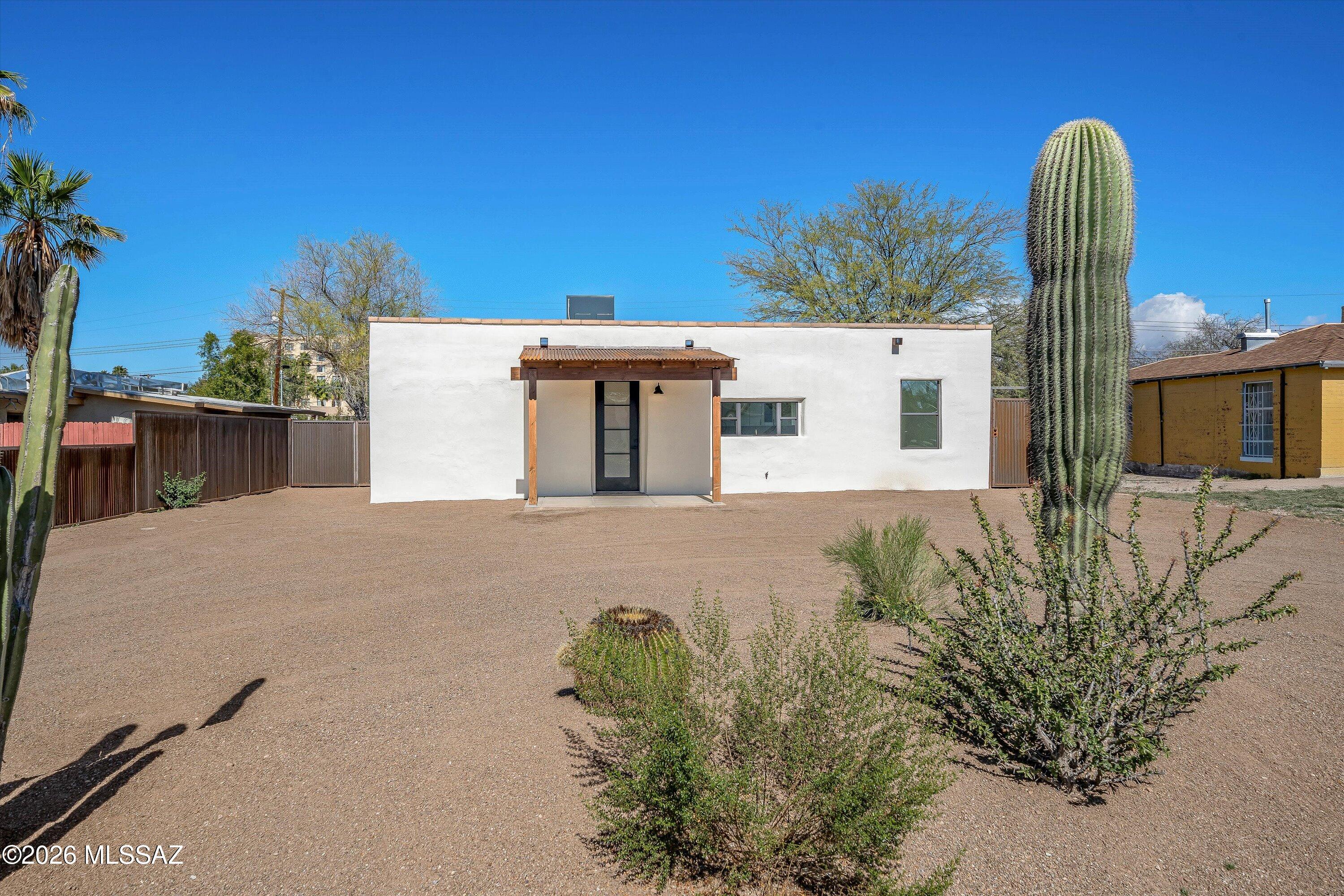 Centrally located, newly renovated 1942 mud adobe with new addition in San Gabriel Neighborhood! This beautiful home has been thoughtfully rebuilt in keeping the existing rich history combined with new modern touches throughout. Showcasing its historical charm with an exposed yet timeless smooth finished mud adobe feature wall. You'll appreciate all new flooring, new kitchen remodel with 42in upper/soft close cabinetry, high ceilings & two owner suites! The all-new addition of the home includes an expanded comfortable primary owner suite. Stunning new bathrooms, walk-in showers, all new doors, fixtures, ceiling fans & most importantly - all new plumbing & electrical panel/system throughout.