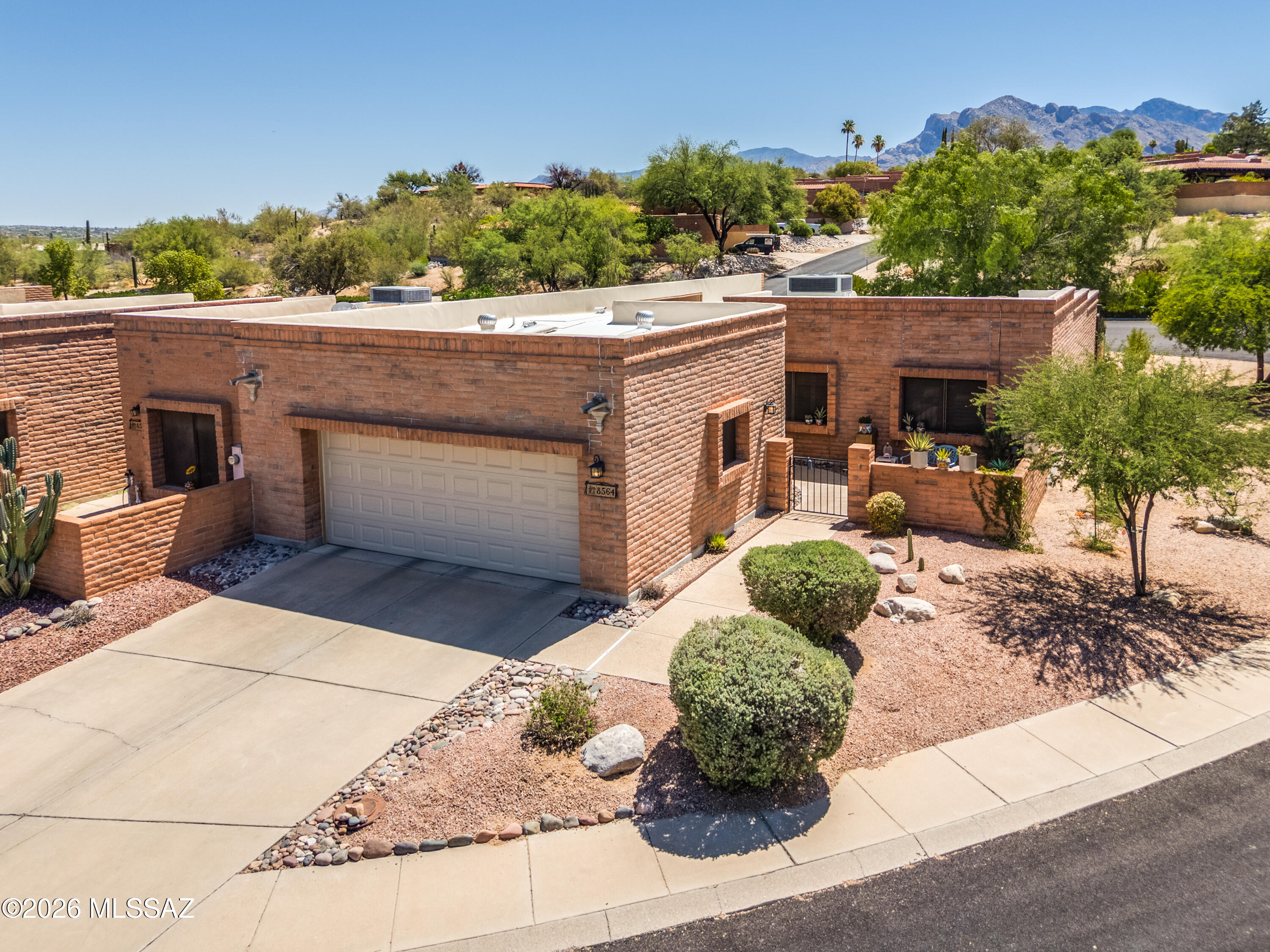 Beautiful patio home in La Cholla Hills, an active adult 55+ community by Fairfield Homes-where quality meets value with solid masonry construction. NEW...HVAC, range, washer, dryer, ceiling fans, garage door, sunscreens, skylights, solatubes, carpet, interior paint, and the roof was recently re-coated. This town home is an end unit with 2-beds, 2-baths, plus a DEN. 1650 sf and boasts a large kitchen with granite countertops breakfast nook, and walk-in pantry. It has a spacious living area and the primary bdrm has a roomy walk-in closet. The lot is large, and the 2-car garage has a window and skylights. Community amenities include 2-pools, 2-spas, pickle ball, shuffleboard, tennis courts, and a clubhouse.