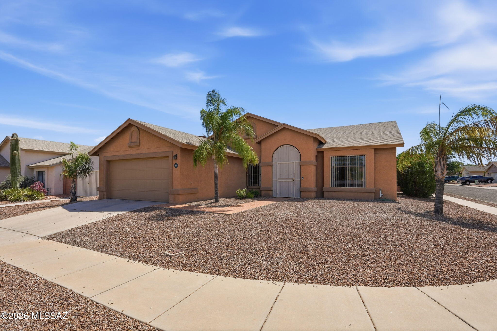 Inviting Berkshire Estates 3BD/2BA + Den single-level home (1957 sq ft) in Northwest Tucson, offering beautiful pool & privacy on a private corner lot. This gorgeous home is constructed w/masonry cinder block & stucco. Bright & open kitchen with breakfast bar & cozy nook that is adjacent to the family room. The home boasts a bright & open floor plan with soaring ceilings, neutral paint, tile flooring throughout & ceiling fans. Primary suite includes a walk-in closet, dual-sink vanity, garden tub & separate walk-in shower. Step outside to your private backyard oasis with a sparkling pool & an extended 10 x 40 covered patio perfect for year-round entertaining, dining or quiet relaxation. Enjoy easy access to top-rated schools, restaurants, shopping, major amenities & quick access to I-10.