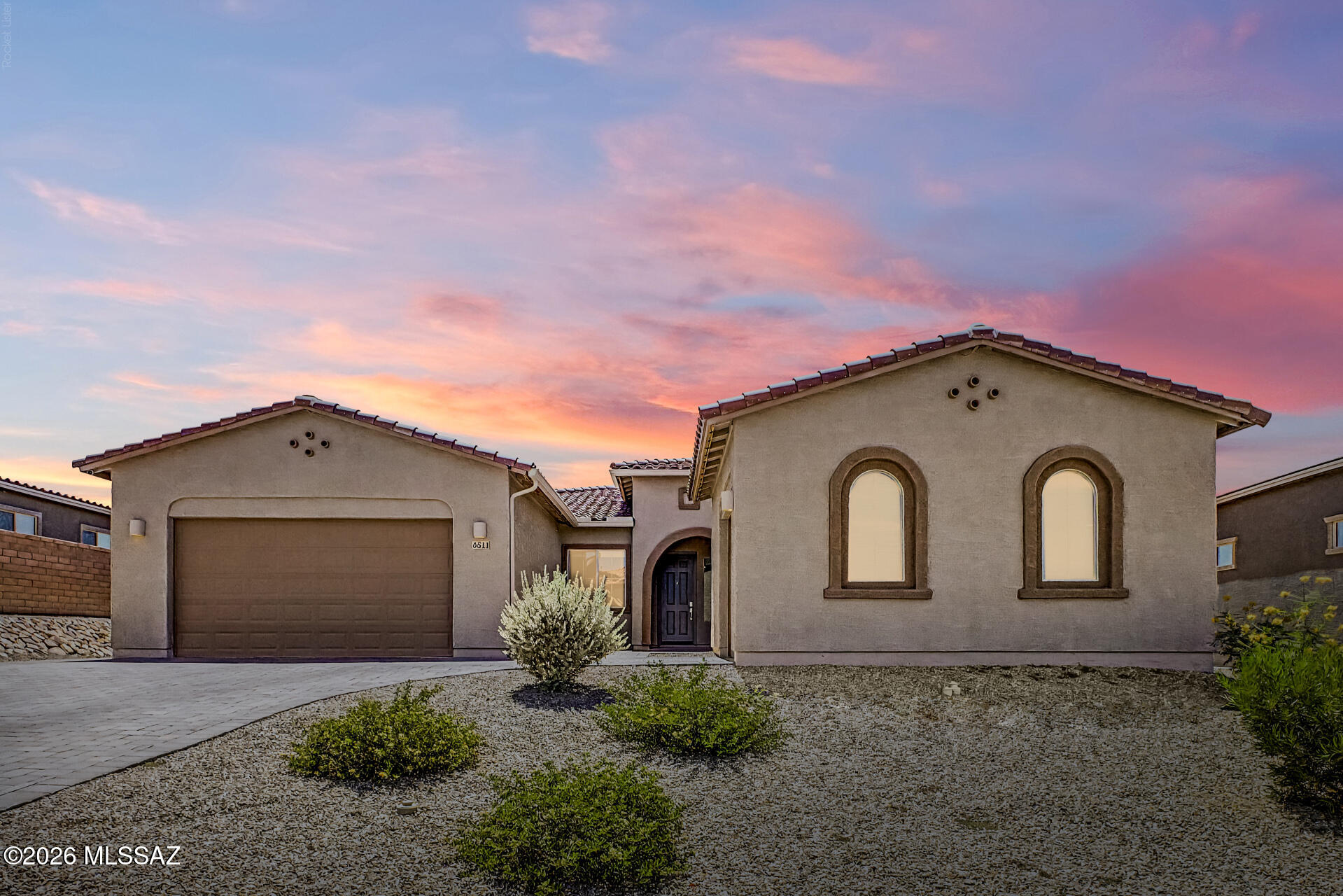 Come experience this turn-key, move-in ready home! Nestled in a peaceful and tranquil community of Dove Mountain. A stone's throw from the Premier Ritz-Carlton, Dove Mountain resort and The Gallery golf courses in the gated community of Los Saguaros. This golf course property backs up to open desert with sweeping mountain views on all sides with a golf course beyond the desert landscape. 

Stunning breathtaking mountain views and effortless Arizona living in this beautifully appointed single-story home with a Pebble tec saltwater pool with wifi smart control Pentair equipment including water feature and smart control multi-color LED lighting.
Discover the unique Sonoran Desert wildlife via the backyard viewing fence. Offering 2,856 sq ft, 4 bedrooms, 3 bathrooms, and a spacious 3-car garage with epoxy flooring and bonus storage racks, in both garages. There is a large open game room /multi-purpose room in the home as well. A whole house water filtration system features water softening and filtration system included. RO filtration system installed in kitchen with alkalizer and filtered RO ice and water system servicing the refrigerator. Fantastic curb appeal with a paver driveway and low-maintenance landscaping, this exceptional home blends comfort, a modern style, and functionality. 

Smart features include app-controlled pool and waterfall automation with a smart cleaning system, a Wi-Fi-enabled Rain Bird irrigation system for the front and back yards, a smart thermostat for energy-efficient climate control, a keyless smart entry lock, and a SimpliSafe smart video doorbell for enhanced security and convenience, and smart garage door openers.  Permanent smart exterior lights already installed, perfect for festive holiday lighting. These functional apps add to the convenience of modern day living. Seamlessly manage your home's essential systems from your smartphone, giving you greater control, efficiency, and peace of mind- whether you're at home or away.

Step inside to discover bright, open-concept living spaces enhanced by ceramic tile and soft carpet flooring, abundant natural light, a neutral color palette, and expansive sliding glass doors that frame the stunning mountain views while providing easy indoor-outdoor living. 

The chef's kitchen is designed to impress with rich espresso cabinetry accented by crown molding, quartz countertops, a stylish tile backsplash, recessed lighting, gas stove top, stainless steel appliances, double ovens, a microwave, and a large center island with breakfast bar seating- perfect for casual dining, entertaining, and everyday meal preparation.

Retreat to the spacious primary suite, where comfort meets convenience. This private sanctuary features soft carpeting, direct backyard access, 2 large private walk-in closets, and a spa-inspired en-suite bathroom complete with dual vanities and a large elegant, tiled shower with a glass enclosure.  Three of the remaining bedrooms are ample sized with soft carpeting and share a hallway bathroom. 

The backyard is an entertainer's dream, offering a covered patio for relaxing mornings or evening sunsets, an extended paver patio with plenty of seating, low-maintenance artificial turf, landscape lighting, a charming pergola for gatherings comes with lighting and powered slats that open and close at will, and a stunning pool surrounded by breathtaking mountain views. Whether you're hosting friends or enjoying a quiet evening at home, this outdoor retreat is sure to impress.

This remarkable home combines outstanding indoor and outdoor living in a spectacular setting. Don't miss the opportunity to make it yours!

Fresh interior paint. Plus, one storage shed positioned near the gate will be conveyed. All appliances to include front loading washer and dryer convey.