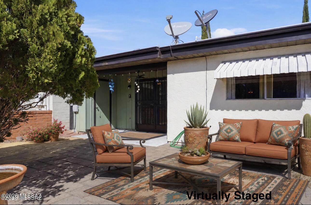 If privacy is on your wish list, this one is worth a look. Backing to open space with no rear neighbors, this beautifully maintained Green Valley townhome offers peaceful desert views, beautiful sunsets, and low-maintenance living in the sought-after Green Valley Recreation community. Whether you're looking for a full-time home or a seasonal retreat, you'll enjoy comfort, convenience, and access to recreation centers, pools, golf, fitness facilities, and a vibrant community lifestyle.