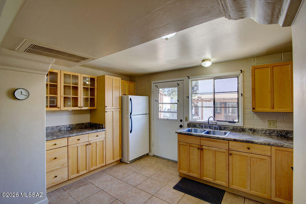 Discover this inviting 588 sq. ft. one-bedroom unit designed for comfort and easy living. The home features all-tile flooring for effortless upkeep and a beautifully updated kitchen with full-size appliances and stylish cabinetry. The spacious great room, accented with neutral tones and built-in shelves, offers the perfect space for relaxing or entertaining.
Step outside to your private front patio, ideal for enjoying Arizona's sunshine or hosting friends. The comprehensive HOA takes care of major essentials, including Roof, HVAC, and water heater replacement, plus exterior paint, pest control, and trash service. Giving you peace of mind and low-maintenance living.
Villas West is a well-established community boasting 65 acres of lush common areas, perfect for social gatherings, pet friendly strolls, and connecting with neighbors. After a fun day at one of the nearby Green Valley Recreation centers, explore the area's wide selection of restaurants offering diverse menus and scenic patio dining. Then come home and step outside to your private front patio. Ideal for morning coffee in the shade or evening gatherings with sunset views.
This property combines convenience, charm, and community and the benefits of east-west exposure. Don't miss your chance to make it yours