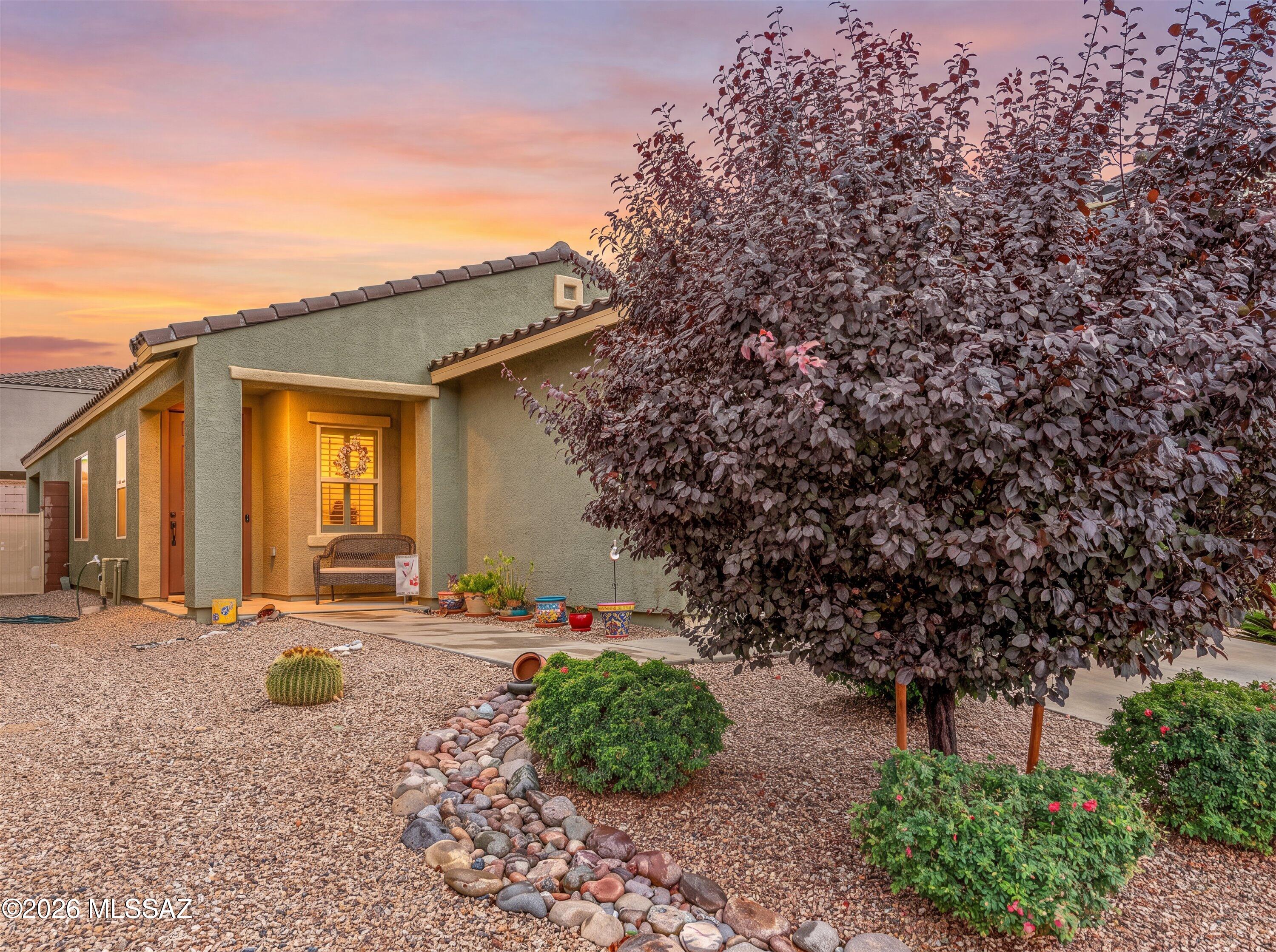 Welcome to beautifully maintained living in the highly sought-after Madera Highlands community, where exceptional amenities, thoughtful upgrades, and an unbeatable value come together. Originally built as a Meritage model home, this residence offers the quality, craftsmanship, and functional upgrades that set it apart from the ordinary.
From the moment you arrive, you'll appreciate the inviting curb appeal and meticulous attention to detail. Inside, the open-concept floor plan is filled with natural light, creating a warm and welcoming atmosphere that feels almost like a brand-new home. The bright kitchen is the heart of the home, featuring granite countertops, crisp white cabinetry, a newer extra-deep farmhouse sink, abundant workspace, and seamless flow into the spacious living and dining areas, perfect for both everyday living and entertaining.
Throughout the home you'll find elegant white plantation shutters, LED energy-efficient lighting in every room, and Ethernet wiring throughout, making it ideal for today's connected lifestyle. Pride of ownership is evident at every turn with newer interior and exterior paint, an impeccably clean interior, and thoughtful updates that allow you to simply move in and enjoy.
The spacious primary suite provides a relaxing retreat with a beautifully upgraded marble walk-in shower, generous proportions, and a light, airy feel. Every space has been carefully maintained and designed with comfort, efficiency, and style in mind.
Step outside to a private, low-maintenance backyard featuring raised privacy walls, a covered patio, and a beautifully designed two-tier garden wall that makes landscaping both attractive and easy to maintain. An upgraded irrigation system helps keep everything thriving with minimal effort, creating the perfect space to enjoy Arizona's beautiful weather.
Additional highlights include a newer water heater, water softener, reverse osmosis system, and numerous energy-efficient features that continue the Meritage reputation for quality construction.
Living in Madera Highlands means enjoying outstanding neighborhood amenities including a community pool, neighborhood parks, expansive green spaces, playgrounds, tennis courts, basketball courts, walking paths, and a true sense of community--all while being conveniently located near shopping, dining, schools, and easy access to Tucson.
Beautifully upgraded, exceptionally maintained, and competitively priced, this move-in ready home offers the perfect combination of style, functionality, energy efficiency, and everyday comfort. It's a rare opportunity to own one of Madera Highlands' most thoughtfully appointed homes.