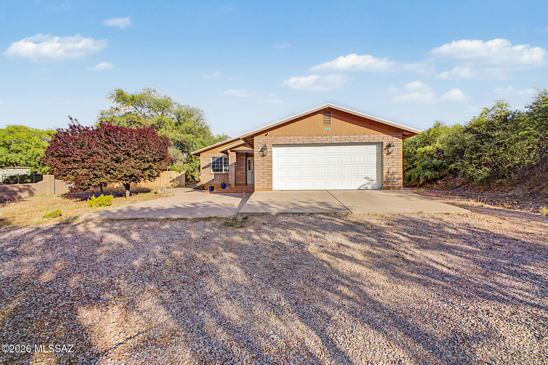 Desert views and a premium corner lot make this single-story home a must-see! Priced from $299,000-$309,000, this 3-bedroom, 2-bath home with a 2-car garage features soaring vaulted ceilings, tile flooring, and bright open living spaces. The spacious kitchen offers oak cabinetry, tile backsplash, ample counter space, and breakfast bar seating. The oversized primary suite includes a walk-in closet, soaking tub, and separate shower. A versatile den is perfect for a home office or retreat, all conveniently located near shopping, dining, and everyday amenities. The backyard includes a covered patio where you can enjoy a refreshing drink and relax, and ample space for outdoor activities with a serene landscape. Don't miss this fantastic opportunity!