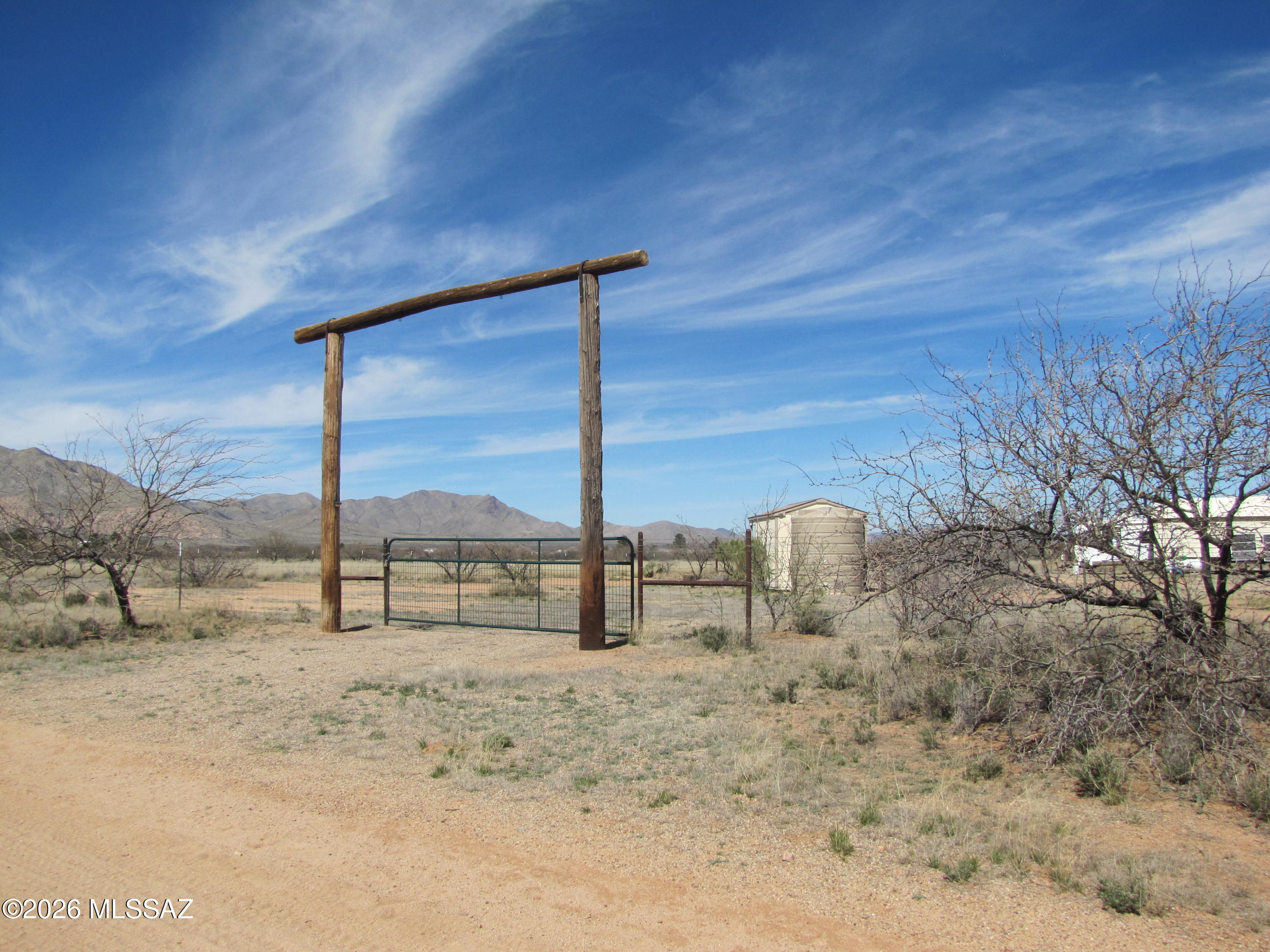Amazing views of Cochise Stronghold from this 3.64ac parcel with all its perks ....fenced & cross-fenced with no-climb and barbed wire, horse shelter with 2 stalls, RV shelter, 2014 RV 32'long with slides and new batteries and 2 RV mats, 3000W inverter & 600W solar panels, 2500gal water tank with pressure tank in shed, septic system, shed with covered porch, 2-2200 Honda generators w/wiring, and the potential of adding another 1.15ac parcel. Propane tank is leased. Property is located a little more than 4 miles from the friendly village of Sunsites with its amenities. Approx 1/2 mile off paved road. Easy access to Hwy 191 and I-10.