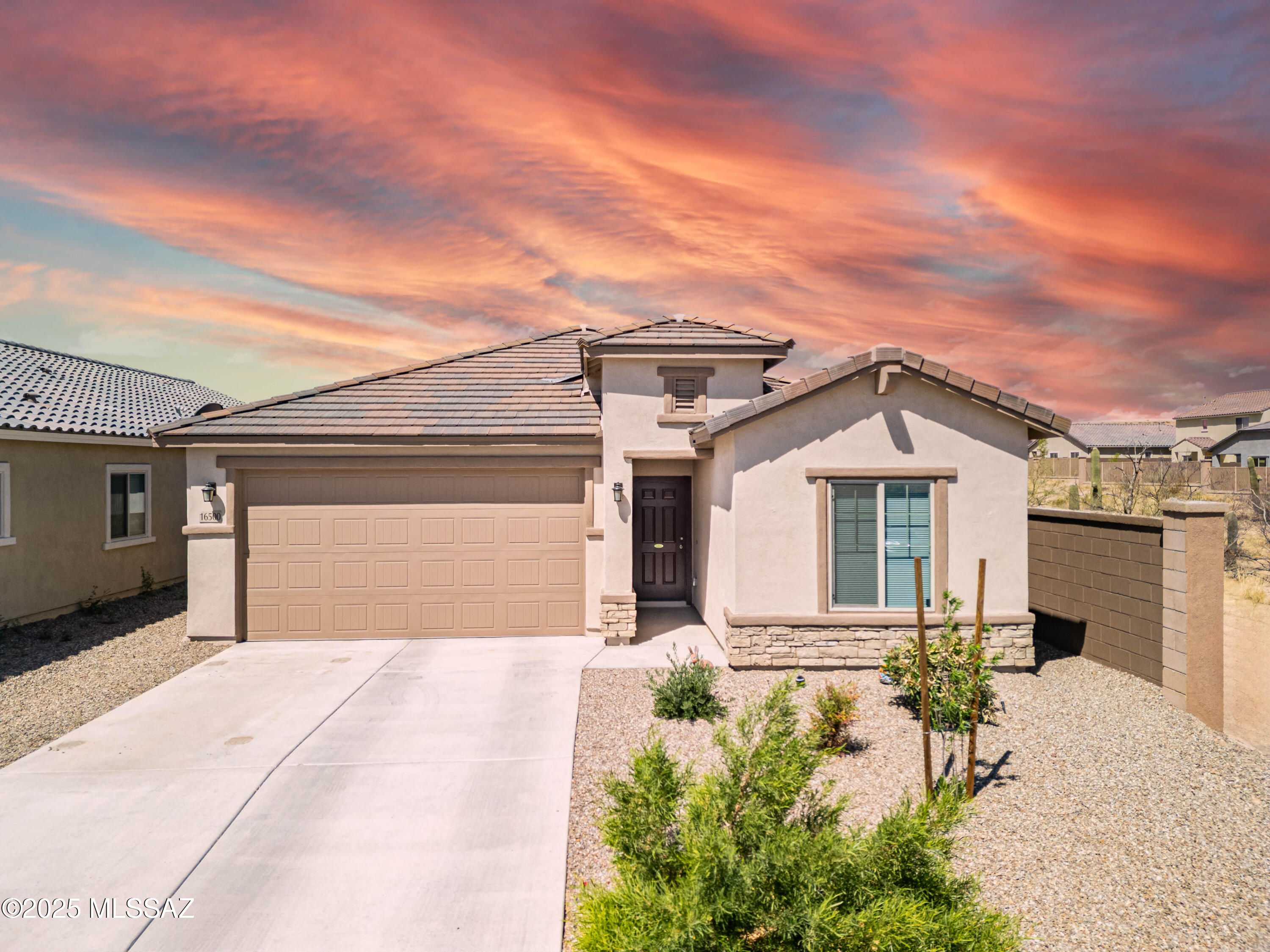 FINALLY!  The search is over!  Welcome home to your almost brand new, 4-bedroom plus den, 2 bathroom, 1915 sqft, single story CORNER LOT at the end of a private cul-de-sac!  This well-constructed home on a quiet street provides a view fence with desert open space and no neighbors behind!  This energy efficient home boasts a beautiful kitchen with large walk-in pantry, tons of cabinet space, and all stainless appliances, including brand new gas range, (although electric hook ups are also available).  Large primary suite gives you massive walk-in closet.  Tankless water heater!  Ceiling fans in most rooms!  Overhead storage racks in garage!  All appliances stay, including refrigerator, washer, and dryer!  Transferrable termite warranty!  Beautiful desert willow tree recently planted in front yard! NO INTERIOR STEPS! Hardware installed for SimpliSafe activation by new owners! Why buy new when this turn-key, move-in ready home is waiting for YOU!