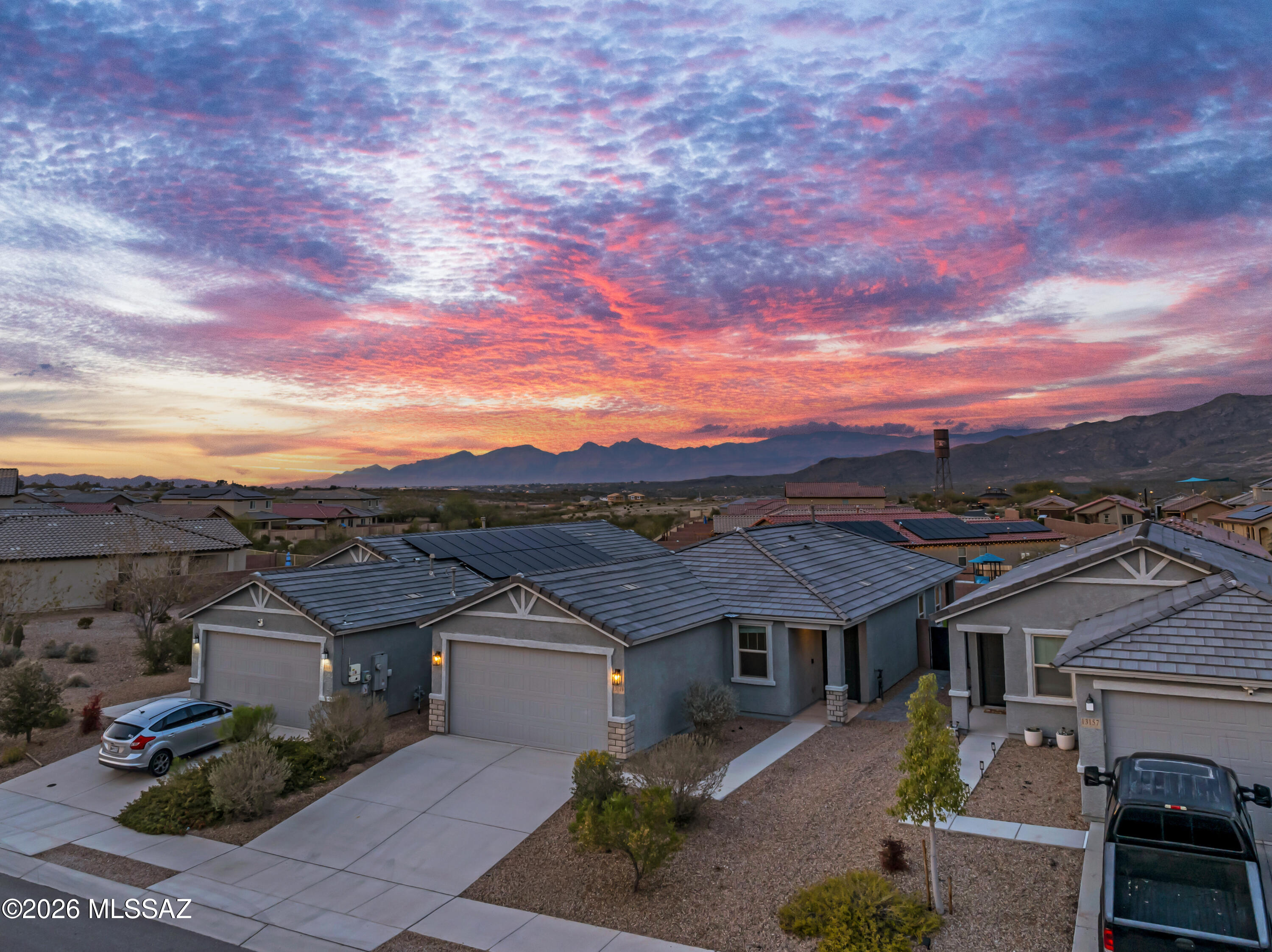 Seller to cover 1 year worth of HOA dues! Built in 2022, this modern masterpiece perfectly blends financial savvy w/ high-end luxury. Imagine mornings relaxing in the den and evenings in a kitchen featuring sleek quartz counters & a 5-burner gas range. Natural light pours through 9ft ceilings onto wood-look tile, leading you to a primary suite w/ Rincon Mountain views. Step outside to your private oasis: a landscaped yard with a Kool Deck patio, designed for sunset entertaining in the top-rated Vail School District. This is more than a house; it's a smart investment in the heart of Vail, AZ real estate. Experience mountain tranquility & modern comfort today!