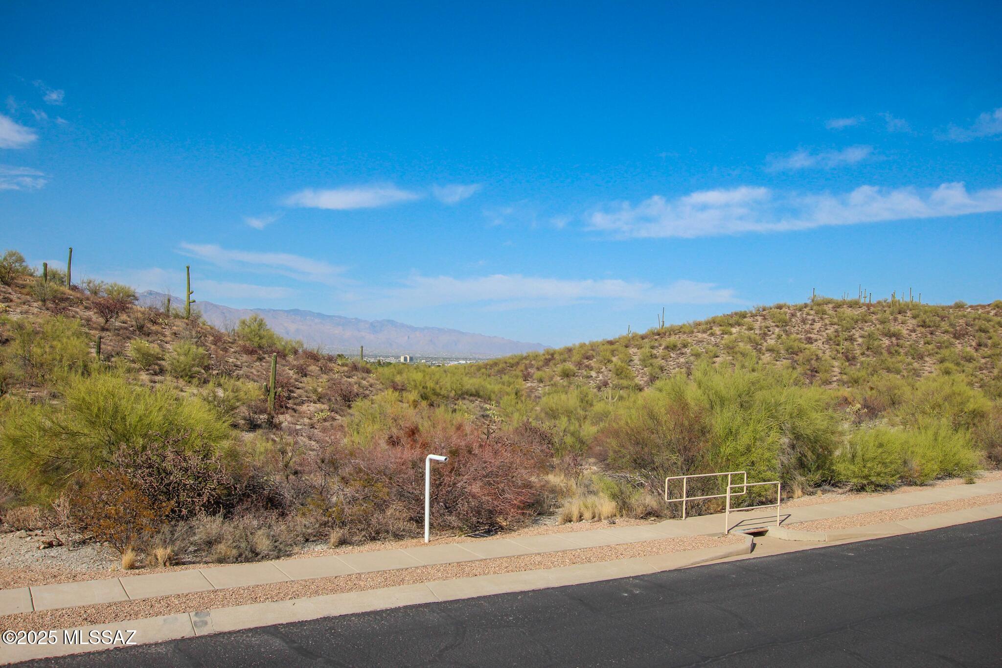 Discover the perfect canvas for your dream home in the prestigious gated community of Coyote Pass at Starr Pass. This 1.57-acre lot is surrounded by stunning custom homes, offering breathtaking mountain and city views. With utilities already in place at the lot line, you can start building right away.
Enjoy the luxury and tranquility of this exclusive neighborhood, while being just a short drive from Downtown Tucson, Mercado San Augustin, top restaurants, shopping, and more.