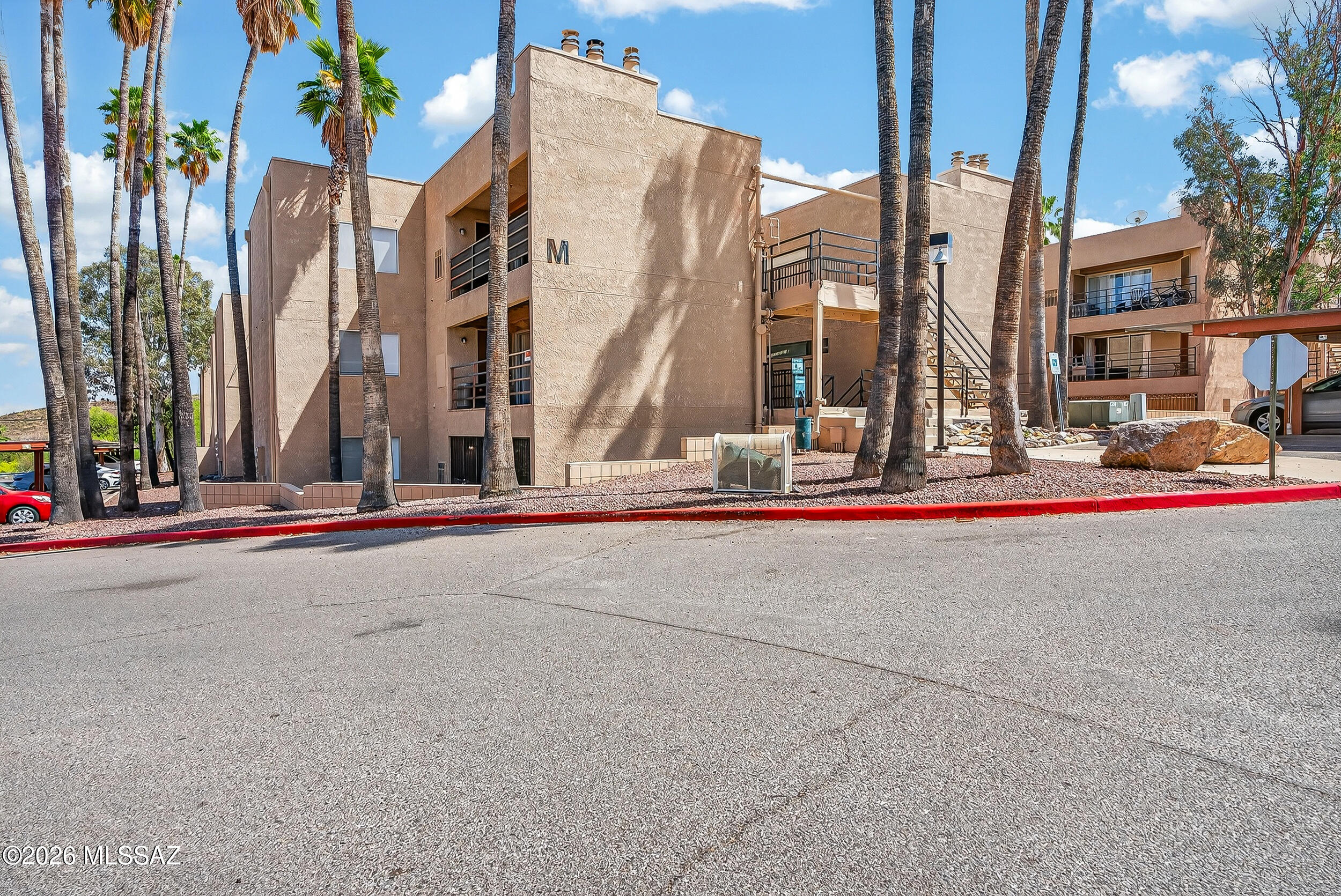 Beautifully updated 1-bed/1-bath single-level condo. Move-in ready w/fresh upgrades: Elkton Pine waterproof LVP flooring, remodeled fireplace w/Desert Ledgestone quartz tile surround, refreshed white cabinetry w/new hardware, new Davies vanity w/cultured marble top in the bath & LED lighting. The open layout features clerestory windows & flows to a private covered balcony. Spacious bedroom offers double closets w/built-in shelving & dual upper/lower hanging rods. Full bath includes tub/shower combo. Recent updates also include HVAC (2021), refrigerator (2023), ceiling fans, security screen door, & freshly painted doors/patio. Covered parking included. Convenient west-side location close to Tumamoc Hill, Pima Community College West, I-10 & shopping. Low-maintenance living at it's best!!