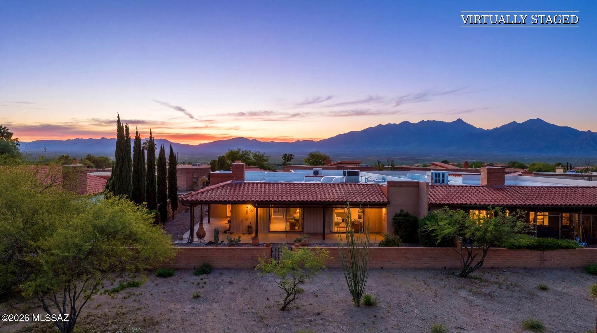 Set above the surrounding desert landscape in Canoa Seca Estates, this Green Valley townhome captures the warmth, natural light, and mountain views that make desert living so appealing. With over 1,800 sq ft, 2 bedrooms, 2 bathrooms, and a layout designed for comfortable everyday living, the home feels both spacious and inviting from the moment you walk in.

Large windows and skylights brighten the main living areas, while the flex space off the kitchen offers room for a home office, sitting area, hobby space, or additional dining. The wraparound patio is the perfect place to enjoy morning coffee, sunset skies, and the surrounding views.

Clean, cared for, and easy to maintain, this home offers a comfortable blend of space, privacy, and the relaxed lifestyle Green Valley is known for.