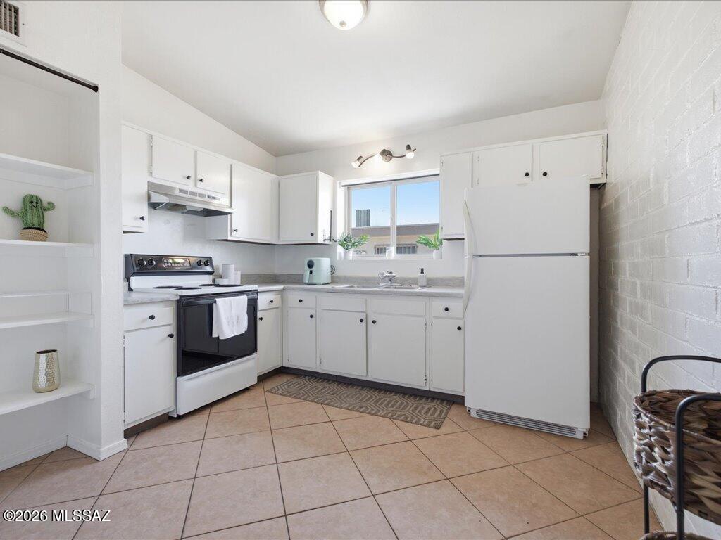 NEW LOWER PRICE! Charming duplex at 1808/1810 E Miles Street featuring two comfortable 2-bedroom, 1-bath units, each with a bright, open layout. The living spaces are inviting and practical, with functional kitchens and bedrooms that make it feel like home from the moment you walk in. Each unit comes with its own washer and dryer, parking, and dedicated laundry area with storage space. Step outside and you'll also find private, fully fenced outdoor spaces for each unit, perfect for relaxing, pets, or a little outdoor setup of your own. Whether you're looking to live in one unit and rent the other, or add a solid duplex to your portfolio, this one offers flexibility without sacrificing comfort. Buyer to verify all facts, figures, and measurements.