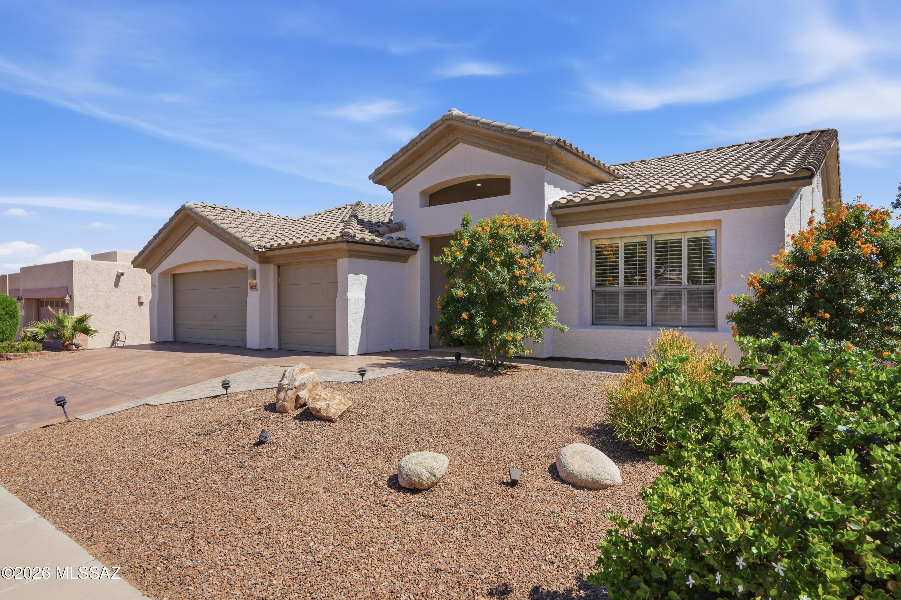 ESTATE SALE!  COMMUNITY POOL!  SOLAR is 100% OWNED - Electric Bill is only $25 a month. Improvements include a BRAND NEW TILE ROOF (April 2026), HVAC under warranty til 2028, water heater, updated windows, new irrigation system, & a mini-split unit in primary. Community POOLS. Single-story home offers an exceptional blend of comfort, space, and privacy. Situated on nearly a ¼-acre lot, the property provides a rare opportunity for expansive outdoor living with added separation from neighboring homes.The seller has made significant investments in the home's major components, offering peace of mind to the next owner.  The backyard is both PRIVATE & versatile, featuring a ramada, basketball court & a large workshop that can easily be a play house, office or studio. ONE OWNER HOME! Inside, the home offers 3 bedrooms, 2 bathrooms, and a 3-car garage with ample storage. The kitchen features stainless steel appliances and granite countertops, providing a functional layout with room to personalize. Conveniently located near I-10 with easy access to shopping, downtown, dining, and everyday amenities, this home combines a prime location, generous lot size, and key system upgrades for strong long-term value.