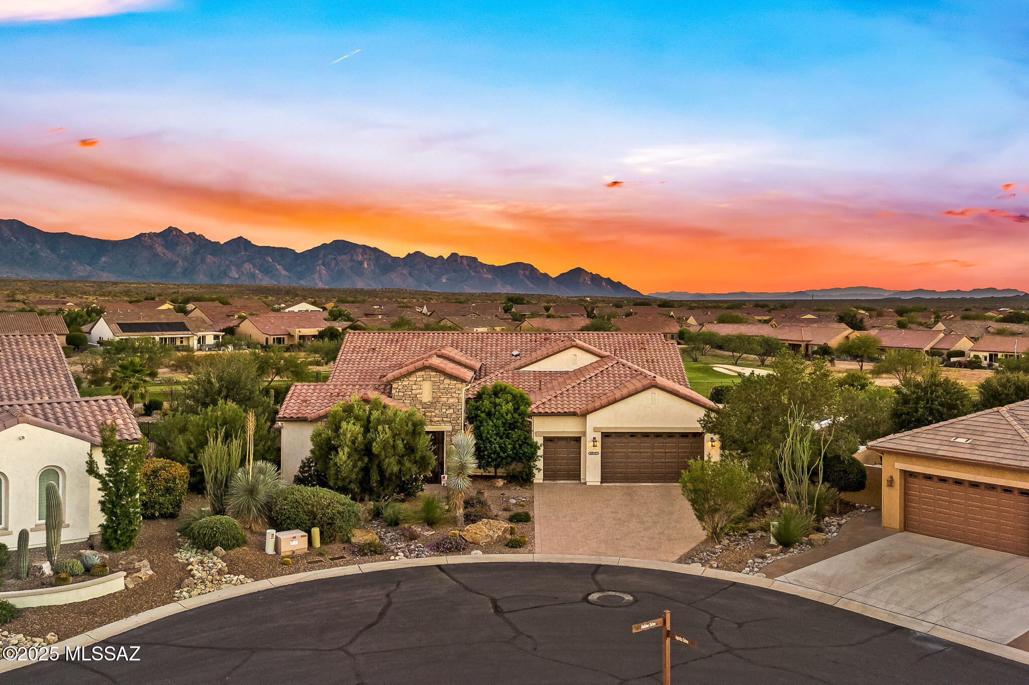 Is there a 3-bedroom home in Saddlebrooke Ranch with mountain and golf course views? Yes—and this beautifully appointed home sits on a sprawling, rare 0.44-acre lot, offering panoramic views that most homes in the community only dream of. Nestled at the end of a cul-de-sac, it blends luxurious design, upgraded finishes, and seamless indoor-outdoor living.

Step through the custom stone entry into a serene front courtyard with a fireplace. Inside, you'll find soaring ceilings, porcelain tile floors, and expansive windows framing the golf course and mountains. Both bedrooms in the main home overlook the golf course and offer private outdoor access—perfect for morning light or evening stargazing.

The chef's kitchen features quartz countertops, a circular skylight, two sinks, a walk-in pantry, and upgraded cabinetry with pull-outs and soft-close drawers. The kitchen also includes a dedicated breakfast area ideal for sharing a meal, watching TV, and overlooking the front courtyard.

The home's open floor plan in the main living area is perfect for large gatherings. Entertaining flows easily between the formal dining room, spacious great room, and covered back patio with automated sun shades.

The primary suite includes two custom closets, dual vanities, an elegant soaking tub, and a luxury shower. A large custom rain glass window provides privacy while relaxing in the tub.

The detached casita offers a third sleeping area or flex space with its own full bath and courtyard entry. All 3.5 bathrooms include upgraded tile, fixtures, and lighting.

The backyard is a private resort: a heated 25,000-gallon pool with retractable cover, built-in BBQ station, artificial turf, and lush desert landscaping. The 3-car garage is extended 4 feet, features built-in storage, and a special floor coating. Additional upgrades include a central vacuum, plantation shutters, and a golf cart bay.

Located in gated Saddlebrooke Ranch with access to golf, pickleball, rec center, and more. Shown by appointment with 2-hour notice.