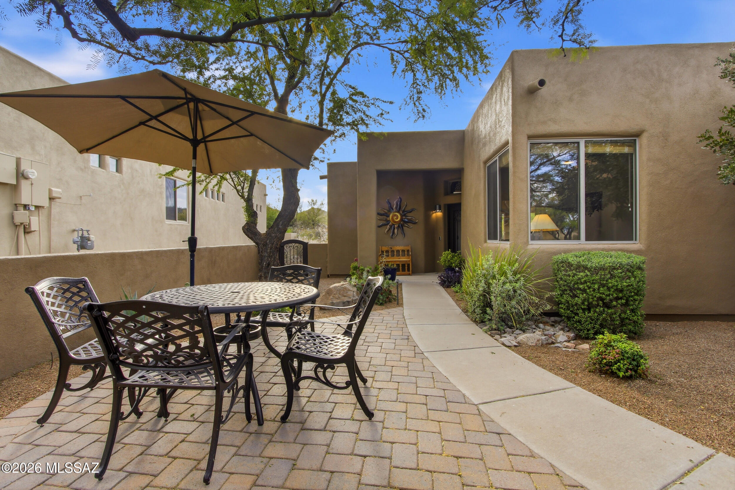 Immaculately maintained and ideally situated on the golf course in Starr Pass, this beautifully updated 3-bedroom, 2-bath home offers the perfect blend of comfort, convenience, and lifestyle. Located within a gated community, it is ideal for those seeking a lock-and-leave residence, seasonal retreat, second home, or easy relocation to Tucson.

The home has been meticulously cared for and features fresh exterior paint along with a brand-new fully enclosed courtyard, creating a private and inviting space that is perfect for gatherings, entertaining, or pets. Continued.... Inside, the thoughtful floorplan offers comfortable living with plenty of natural light and seamless indoor-outdoor flow. The backyard is a true highlight, featuring an extended paver patio, putting green, and direct frontage on the lush fairway at Starr Pass, providing beautiful views and a tranquil setting.

Conveniently located close to shopping, dining, recreation, golf, and all the amenities Tucson has to offer, this home delivers an exceptional lifestyle in one of the area's most desirable communities.