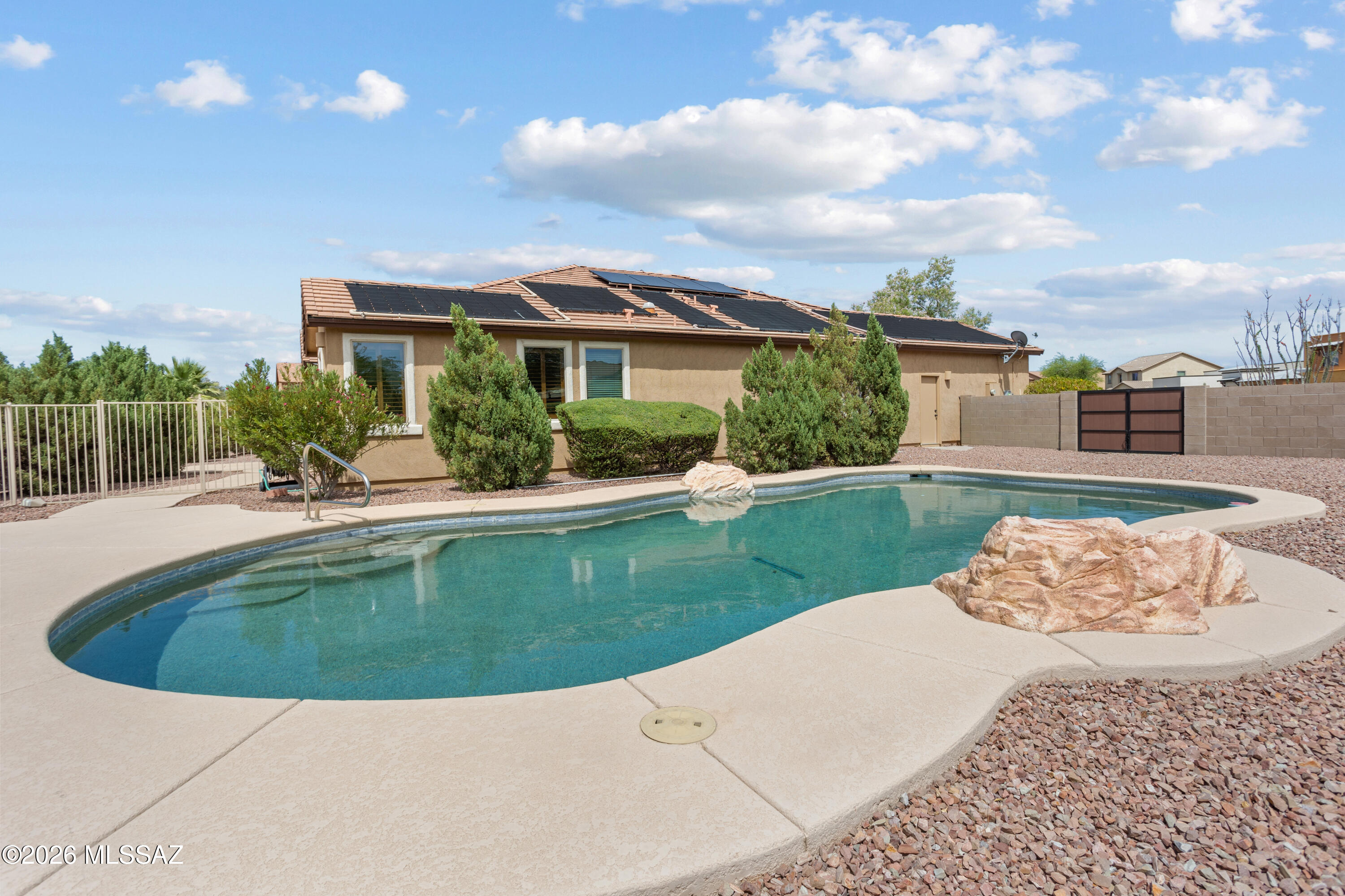 Come see this well-maintained and clean 4 bedroom, 3 full bath, 2350 sqft home. The home sits on a premium, .29-acre cul-de-sac lot with a large passive-solar heated pebble tech pool. Mature landscaping on a drip irrigation system provides privacy and warmth to the exterior.  The entrance foyer flows to a bonus room suitable for a formal living, dining, or billiard area. The gourmet kitchen has 42'' uppers, newer high-end appliances, granite counters, a large island, under-cabinet lighting, custom backsplash, and pull-out drawers in the pantry and base cabinets. The kitchen, dining area, and family room flow seamlessly, perfect for everyday living and entertaining. Solar panels, plantation shutters, ceiling fans, new carpet, and community park are the cherry on top of this beautiful home!