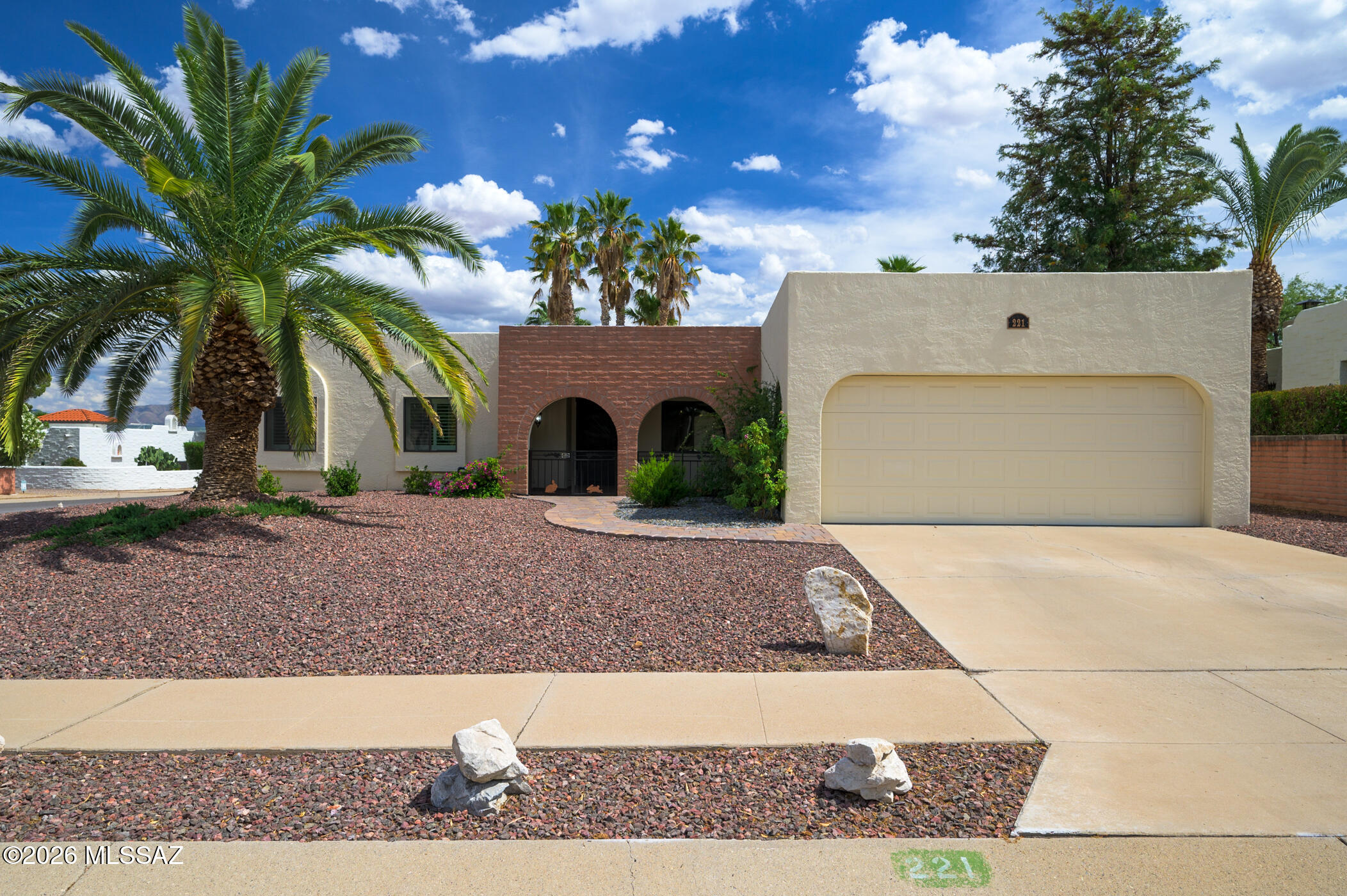 Enjoy the best of Southern Arizona living in this 3 bedroom corner lot, located in Country Club Vistas with easy access to I-19 yet far enough away not to be bothered by traffic noise. The backyard has been designed for peace and privacy, with decorative rock, pavers, fruit trees, and oleanders creating a serene setting with mountain views. Enjoy a covered front patio as well that has been recently fenced-in that will allow you to enjoy beautiful Green Valley mornings. Inside you'll find an elegant and earth-toned Travertine tile and new carpeting in the bedrooms as of 2023. There's also a new black pantry that conveys, a whole-house filter, kitchen butcher block island with an attractive backsplash in the kitchen, a large primary bedroom suite with walk-in shower and separate door to the backyard, rear French doors, dual-paned windows, plantation shutters, a flat driveway, front irrigation, sidewalks in the community, and a very low HOA. Reach out today for your own private tour!