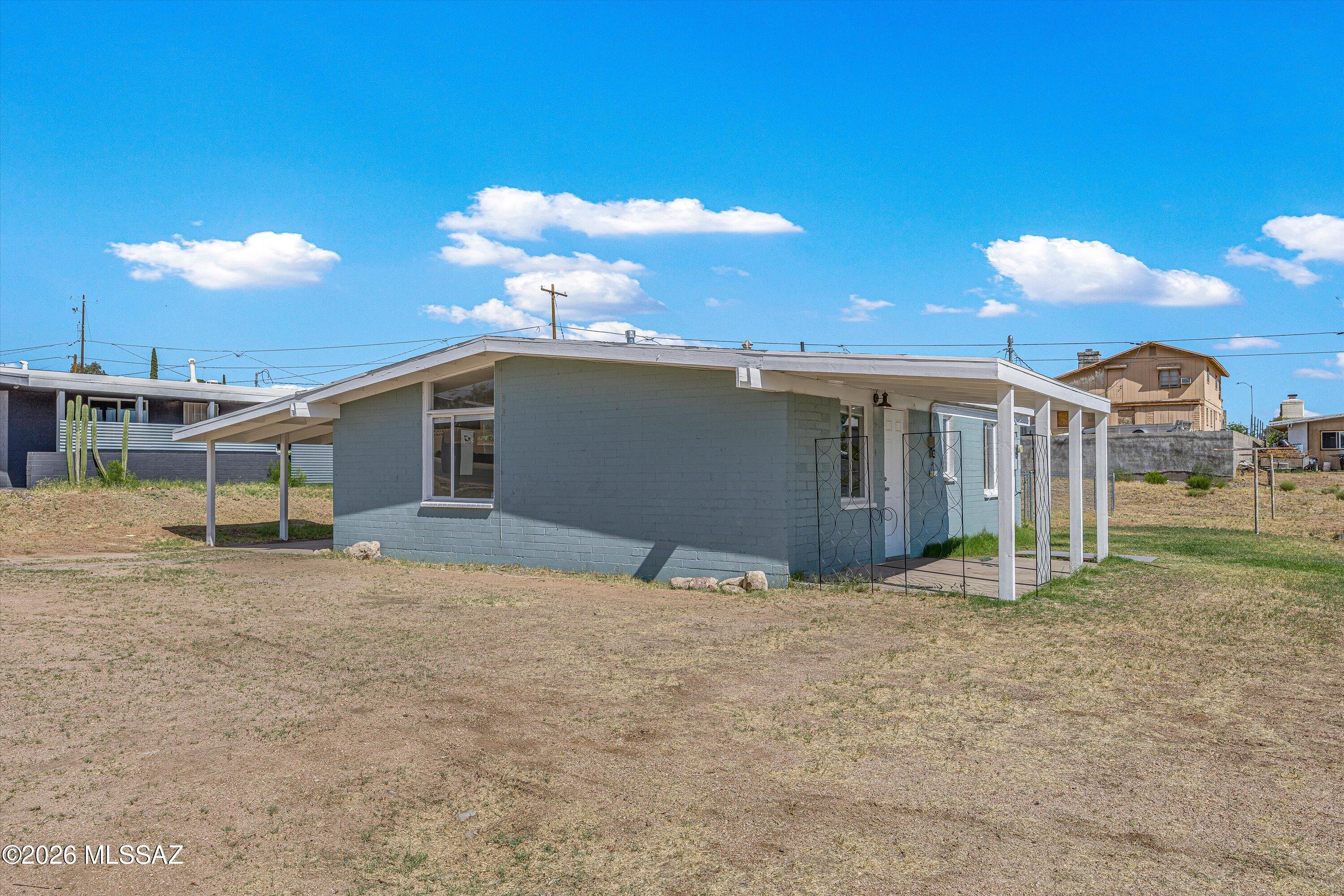 This charming 2-bedroom, 1-bath home has been updated with central AC and tile flooring throughout. Newly painted interior! The home includes the refrigerator, dishwasher, and gas stove.  The exterior offers a fenced backyard and a carport for shaded parking. Covered laundry hook-ups are located on the porch. Please contact the property manager for application / deposit info and to schedule a showing.