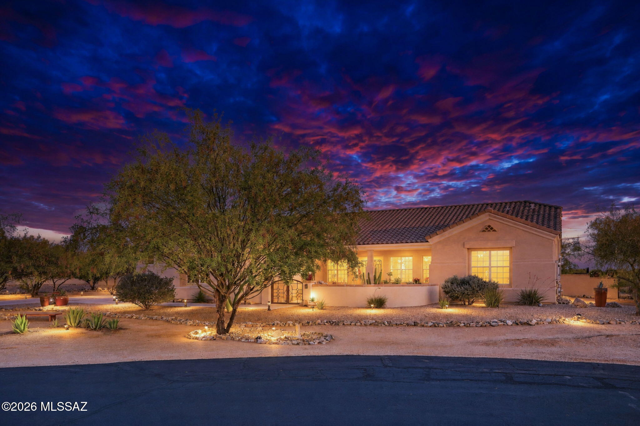 Welcome to the gated community of Tierra Linda Nueva! Tucked away on a quiet cul-de-sac and sitting on nearly an acre, this home offers the perfect combination of privacy, space, and great indoor-outdoor living. The open great room, floor plan, creates an easy flow for everyday living and entertaining, with the kitchen that opens directly to the main living area. Just off the entry, you'll find two flexible spaces that can be used as a formal dining room, sitting area, home office, or whatever fits your lifestyle. The spacious primary suite is a true retreat.  The secondary bedrooms are situated with a desirable split floor plan where you find the second bedroom which features its own en-suite bath and adjoining flex space that's perfect for guests, a game room, or private lounge area. Two additional bedrooms and a guest bath with dual sinks complete the interior layout. Out back, the resort-style yard is the star of the show, featuring a pool, hot tub, outdoor shower, fire pit, built in BBQ area, water feature pond, expansive entertaining space, and mountain views in the distance. It's the kind of backyard that makes it easy to host friends or simply unwind and enjoy the peaceful and quiet desert. But it doesn't end there, this home also has OWNED SOLAR with TWO batteries, making those hot summer days feel nice and cool for a fraction of the cost!