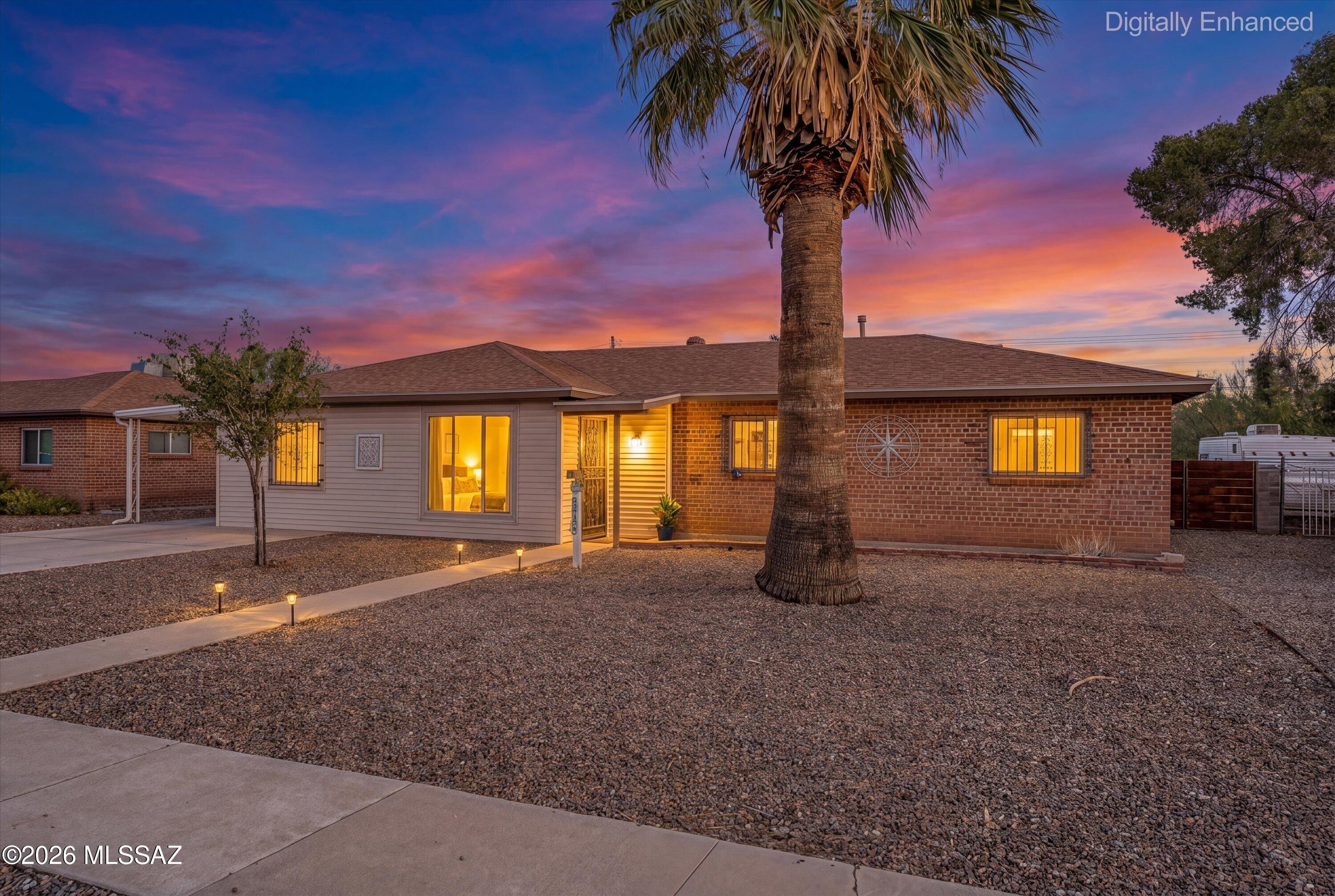 Move-in ready brick home offering 4 bedrooms, 2 bathrooms, and a flexible floor plan in a convenient central Tucson location. This well-maintained home features updated dual-pane windows and a beautiful kitchen with a breakfast bar, ample cabinetry, and matching appliances. The versatile 4th bedroom is thoughtfully separated from the other bedrooms, making it ideal as a home office, guest room, playroom, or hobby space. Enjoy the desirable north/south orientation and relax under the covered patio with Catalina Mountain views and plenty of afternoon shade. The spacious backyard provides room to entertain, garden, or simply unwind, and includes two large workshop/storage sheds perfect for hobbies, projects, or extra storage. Located near schools, shopping, dining, public transportation, and and Palo Verde Park, featuring a pool, dog park, and recreation areas. This versatile home offers comfort, functionality, and space both inside and out.