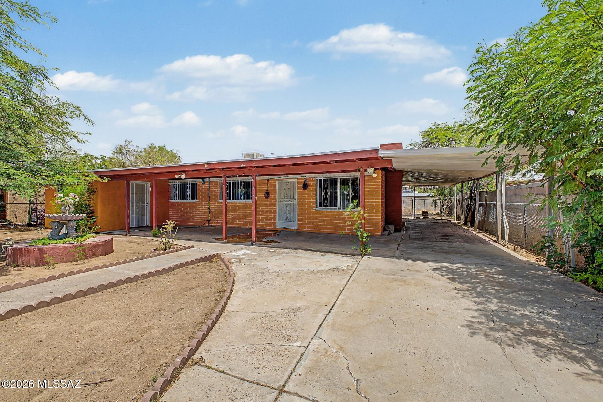 Great opportunity for an owner-occupant, investor, or contractor looking to add value. This Territorial-style home is being sold AS-IS and offers approximately 1,942 sq. ft. of enclosed living space with 4 bedrooms, 2 bathrooms, a spacious living room, dining area, laundry room, den, and multiple bonus rooms. The original home consists of approximately 1,183 sq. ft. as reflected in the original floor plan.
The property also includes approximately 759 sq. ft. of unpermitted additions, expanding the home with a large primary bedroom, an additional bedroom, second bathroom, den, laundry room, and bonus rooms, creating a flexible floor plan with abundant living space. Conveniently located in South Tucson with no HOA, this property offers tremendous potential for renovation, rental income, or customization.