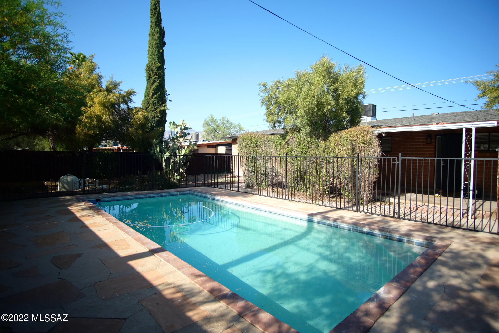 Text for a walkthrough video or more info. El Cerrito Estates 3 Bedroom/2 Bathroom 1478sf brick Home WITH A POOL + incl Pool Service. This fully remodeled Home features ceramic tile flooring throughout, new lighting, Granite Countertops, Central Air Conditioning, and a Car Port. Located in the Mountain/1st neighborhood close to Salpointe Catholic HS, Banner University Med Center, University of Arizona, and Downtown Tucson. 12mo minimum Lease. Costs incl; Non-refundable $50/adult Application, $2195 Security Deposit, $150/pet with approved pet, $400 cleaning fee. Tenant pays water/sewer/trash, electric, and gas. Owner REQUIRES Renters' Insurance.