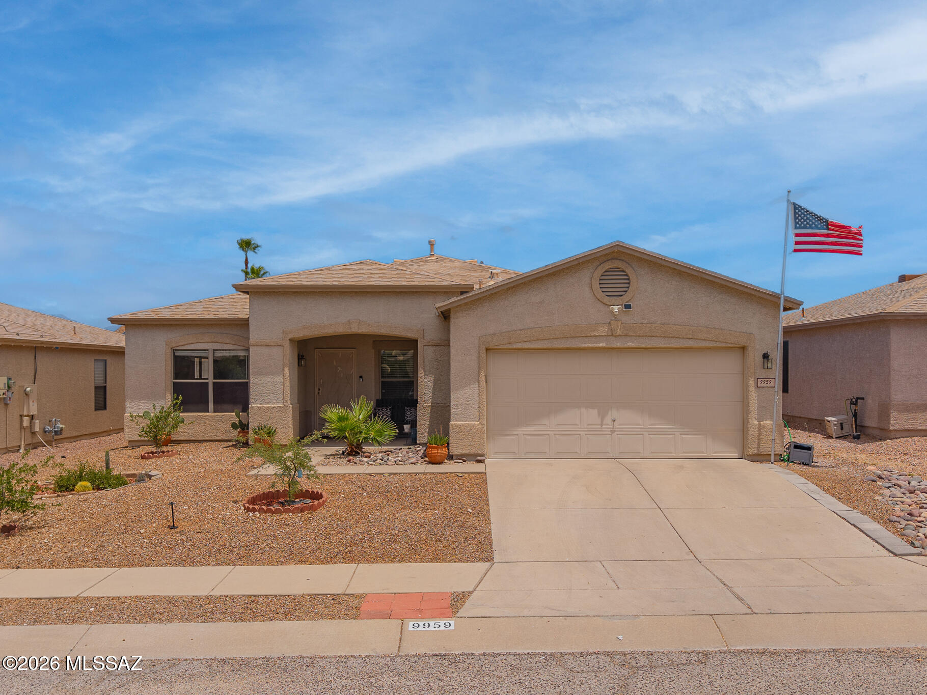 Welcome to this beautifully maintained 4-bedroom, 2-bath home with a 2-car garage, offering the perfect blend of comfort, space, and low-maintenance living. The open-concept floor plan features bright, spacious living and dining areas that flow seamlessly into the kitchen, complete with abundant cabinetry, generous counter space, and a center island. Large windows fill the home with natural light, while neutral finishes and tile flooring create a clean, move-in-ready feel. Step outside to an impressive backyard retreat featuring a covered patio with ceiling fans, an expansive paver patio, artificial turf, mature landscaping, and decorative retaining walls. Designed for year-round enjoyment, this private outdoor space is ideal for relaxing or entertaining family and friends. Move-in ready and thoughtfully designed, this home is one you won't want to miss.
