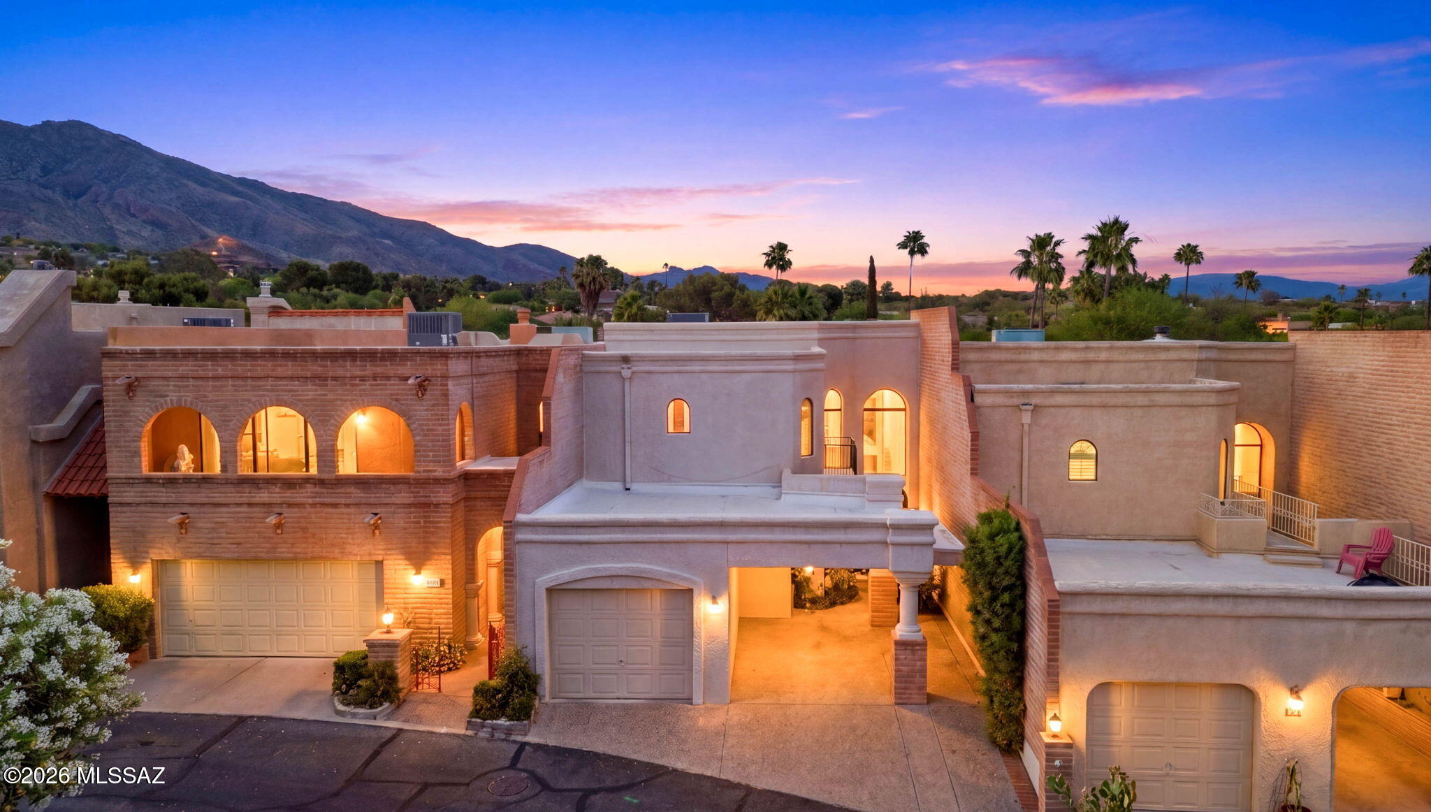 GOLF COURSE and MOUNTAIN VIEWS in a guard-gated community in the Catalina Foothills? Here it is! A rare opportunity to experience the best of Tucson's luxury lifestyle in one of the city's most sought-after communities. Tucked within the prestigious Skyline Country Club, this beautifully remodeled townhouse blends relaxed desert living with timeless style. Vaulted ceilings, expansive windows, and glass doors fill the home with warm natural light, while inviting indoor-outdoor spaces create an effortless flow for entertaining with a sunset or quiet morning sunrises overlooking the golf course. Enjoy your mornings & evenings on private patios and balconies framed by Catalina Mountains, with world-class golf, shopping, hiking, dining, and resort-style amenities just moments away.