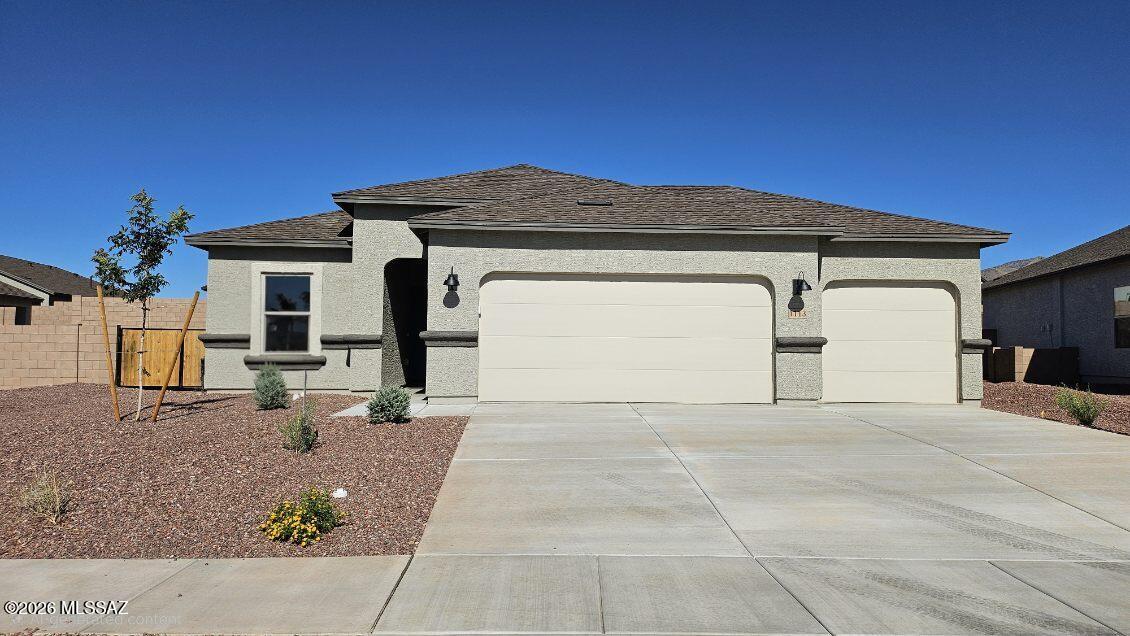 This home is READY NOW! Snuggled within the serene surroundings of Sycamore Vista, The Baxter offers a blend of comfort and convenience, making it a perfect fit for modern living. Spanning 1,423 square feet, this thoughtfully crafted single-story home features three bedrooms, two bathrooms, and a 3- car garage, all within the picturesque foothills of the Santa Rita Mountains.
As you step onto the welcoming front porch and enter through the foyer, you're greeted by a spacious and open floor plan that flows effortlessly into the heart of the home. The great room is designed for both relaxation and socializing, seamlessly connecting to the dining area and kitchen.